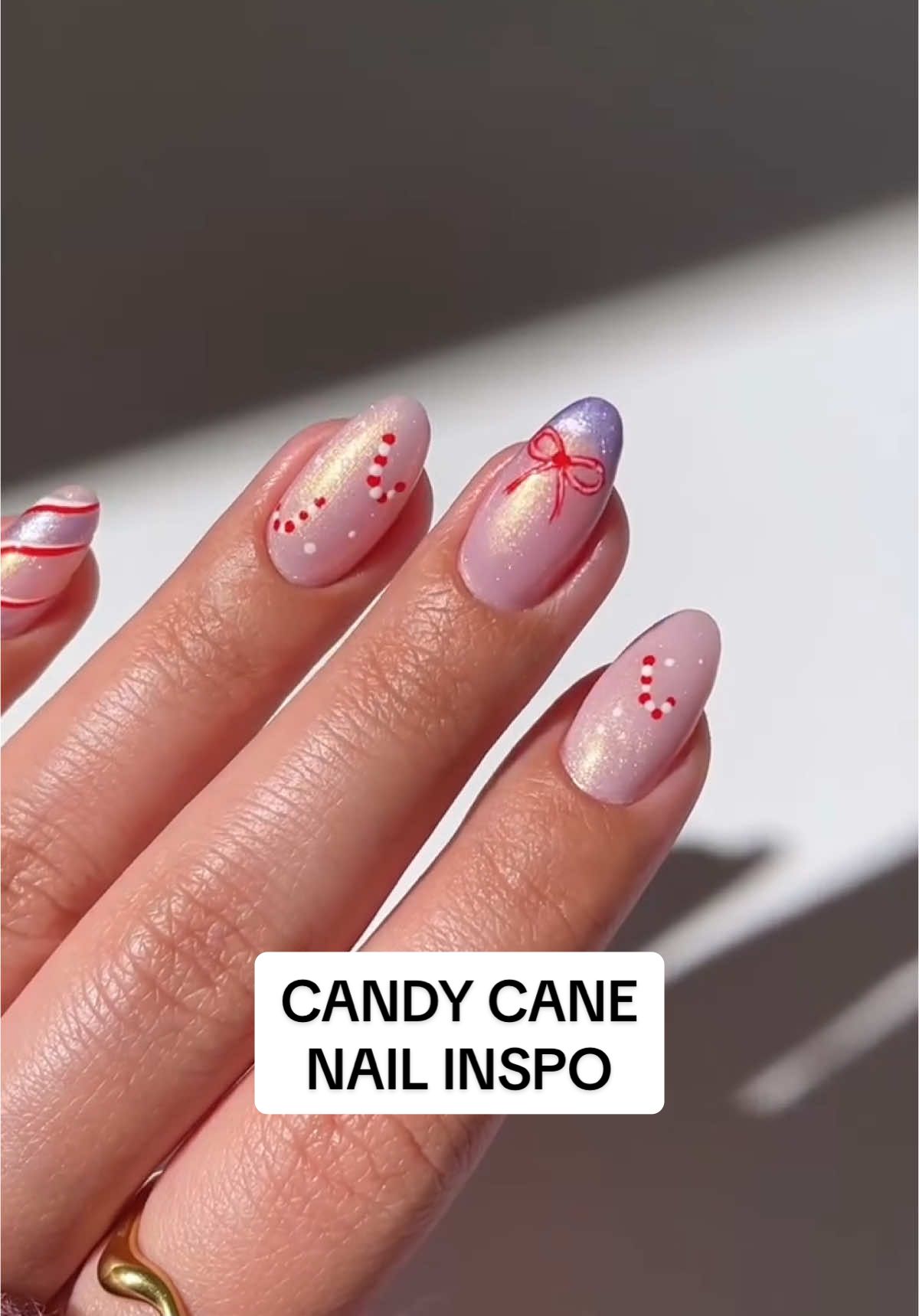 You can never have enough holiday nail inspo ❤️🤍 Save these candy cane nails by @Simu ✿ for your next nail appt 💅✨  #revolve #holidaynails #nails #nailinspo #nailart #naildesign #nailtutorial #candycanenails #christmasnails #sparklynails 