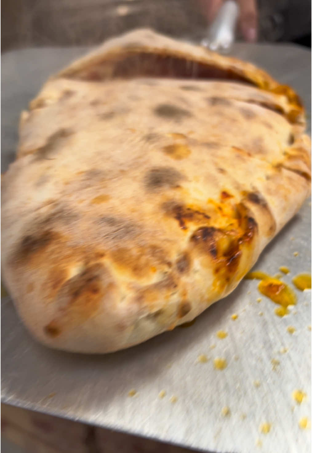 Steaming Hot🔥Giant calzone! . . . #PizzaLovers #PizzaTime #CheesyGoodness #PizzaArt #FoodieLife #PizzaPerfection #SliceOfHeaven #PizzaGoals #EpicEats #PizzaCravings #FoodTikTok #PizzaVibes #FoodPorn #PizzaCreation #InstaPizza #burattinopizza #120pepperoni #crunchbabycrunch