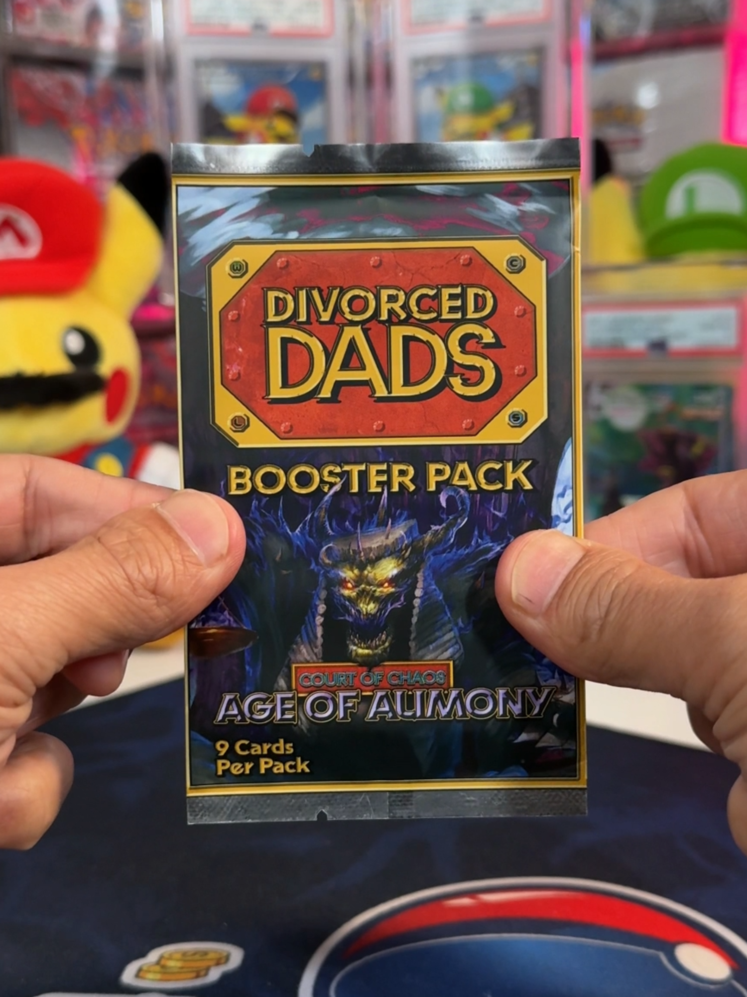 Episode 155 of Should I Open it? Or Should I Keep it Sealed? - Divorced Dads Age of Alimony - the second time we're opening this viral pack, although the last time you all called out the AI Art that was used. In this newer set, the founder decided to hire real artists, which is great. Let's see what it's like, and if we can pull the house! #divorceddads #divorceddadstcg