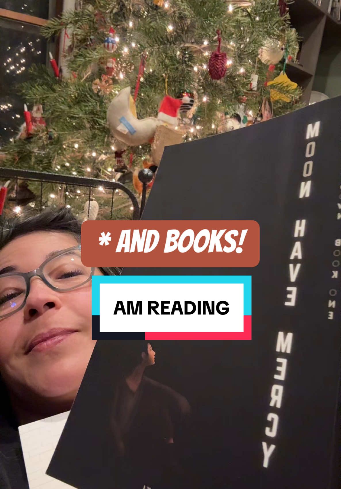 Obsessed with @ASMiyasaki 🖊️ 📚 ‘s book, Moon Have Mercy. Haven’t felt like I could just sit and read in weeks. I ahve also not felt festive at all, since November. But I’ve got the right book and the right bit of time and the right company tonight and it feels like luxury. And good cheer. Just passing it along…. Go follow A.S. Miyasaki. She’s so great and uou’ll love getting to know her book.  #amreading #scifi #moonhavemercy #bookrecommendations #christmas #tbr #story #fyp #authorsoftiktok #writer #storytime #foryourpageofficiall 