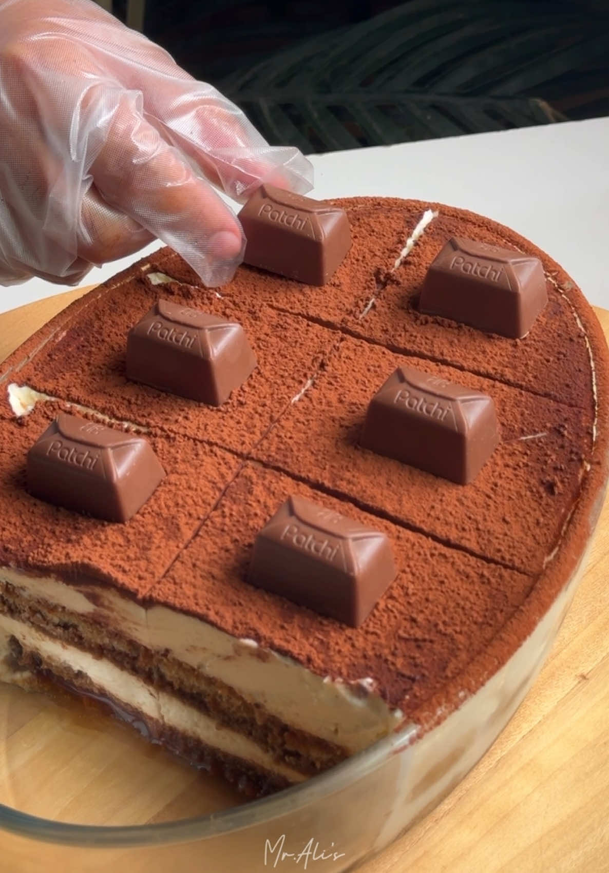 Tips dari Mr. Ali bila nak buat tiramisu dan bagi lagi  sedap :  - pakai kopi espresso coffee.  - kaup  mascarpone guna spatula je sebatikan dengan gula dan egg yolk yg kita dah double boil tau. Jangan pakai yg raw punya . Asal sebati je satu tone warna dah stop . Terlebih buat nanti jadi cair sgt.  - bila dah sebatikan adunan mascarpone ni bila dah sebatikan dengan whipping cream pula, baru pakai mixer speed sederhana je. Bila putar cream dah membentuk garisan or kita rasa dh gebu terus stop beat. If teruskan dia akan jadi cair .  - tiramisu ni kita makan bila dah semalaman tau. Bukan sejam dua dh makan. Nk sebatikan lagi rasa coffee dan cream dan bagi ladyfingers serap lebihan celupan kopi. Resepi : 👇 Resepi Tiramisu by Mr. Ali :  - larutkan :  4 sudu makan serbuk kopi 1 cawan air panas  1 sudu kecil gula - dah larut sejukkan seketika - double boil:  2 biji telur kuning 20g gula Sedikit essen vanila - kacau sampai gula larut dan adunan bertukar menjadi kuning pucat. Matikan api dan sejukkan seketika - sebatikan 500g mascarpone cheese 70g gula 300g dairy whipping cream Adunan telur kuning yg sudah kita double boil tadi - bila dah sebati , boleh start layering - biskut ladyfingers memadai dicelup 2-3 saat sahaja dan susun seperti dalam video - sejukkan semalaman dan dah siap!  Selamat mencuba semua!