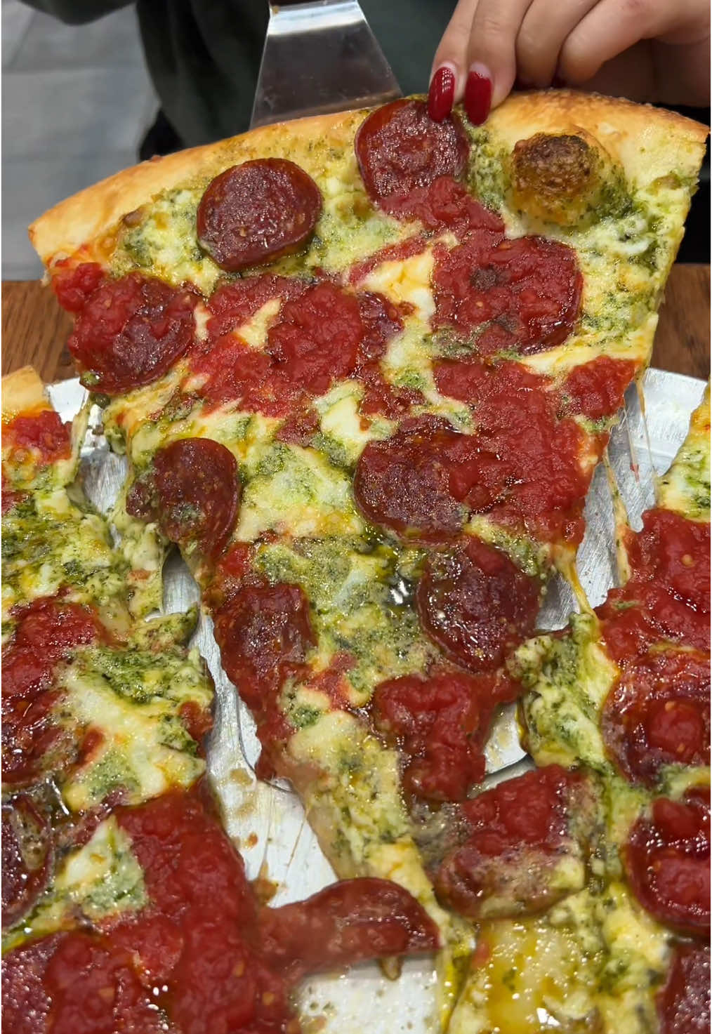 The PESTO PEPPERONI PIE from @Nuovo York Pizza in NYC’s East Village!! 🍕🔥🤤 SO GOOD. Who’s hungry?? #DEVOURPOWER #fyp #foryou #foodtiktok #nuovoyorkpizza #pizza #nycpizza #pizzanyc #pesto #pepperoni #pepperonipizza #newyorkcity 