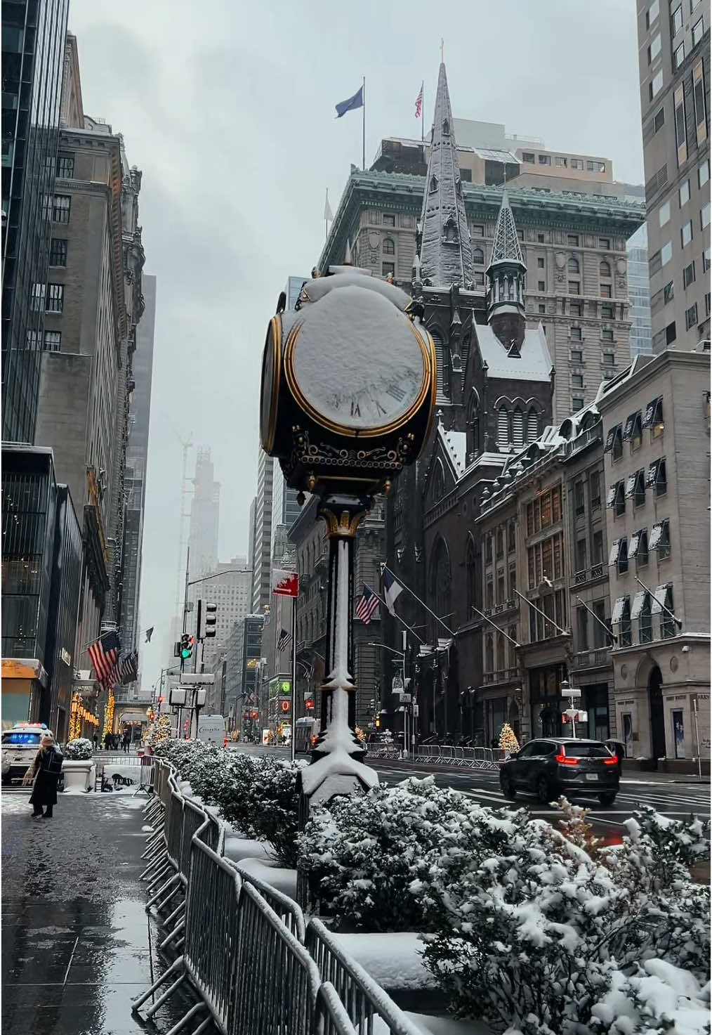 The snow fell softly, blanketing the city in a hushed silence. The usual noise of car horns and sirens was muffled, replaced by the gentle patter of snowflakes against the windows. Even the iconic yellow cabs seemed lost, their lights barely piercing the gloom. New Yorkers huddled under a tattered umbrella, their shoulders slumped, mirroring the city’s somber mood #newyork #nyc #newyorkcity #manhattan #fifthavenue #city #citythatneversleeps #iamtseringgrg #fyp 