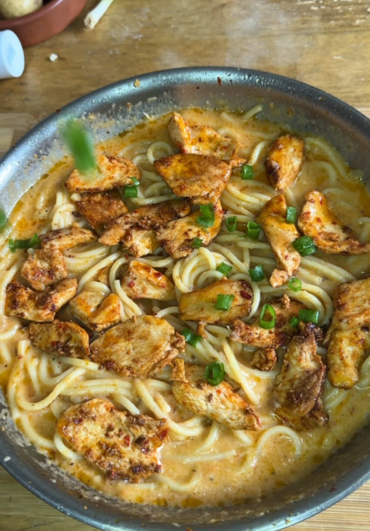 Creamy pasta recipe👇                            •	For the chicken: 	•	1 tbsp oil 	•	2 tbsp butter 	•     chicken breasts (sliced) 	•	½ tbsp cumin powder 	•	½ tbsp chili flakes 	•	1 tbsp sriracha sauce 	•	1 tbsp chili purée  	•	Salt, to taste 	•	For the roasted tomato sauce: 	•	2 medium tomatoes 	•	2  garlic bulbs 	•	3 shallots, halved 	•	1 tbsp olive oil 	•	Salt, to taste 	•	 parsley 	•	For the pasta: 	•	1 cup milk 	•	½ cup grated cheese 	•	250g pasta (any type you like) 	•	Green onions, 	•	Parmesan cheese Instructions: 	1.	Cook chicken: Heat oil and butter in a pan. Add chicken with cumin, chili flakes, sriracha, chili purée, and salt. Cook until tender. Set aside. 	2.	Roast veggies: Roast tomatoes, garlic, and shallots at 200°C for 10 minutes. Blend into a smooth paste. 	3.	Make sauce: In the same pan, add the blended sauce, milk, and cheese. Stir until combined and thickened. 	4.	Combine: Cook pasta, then mix into the sauce with the chicken. Garnish with green onions and Parmesan. #pasta #creamypasta #cheesypasta #chickenpasta #recipes #foryour #foryoupage❤️❤️ #fyp #foru #fyppppppppppppppppppppppp 