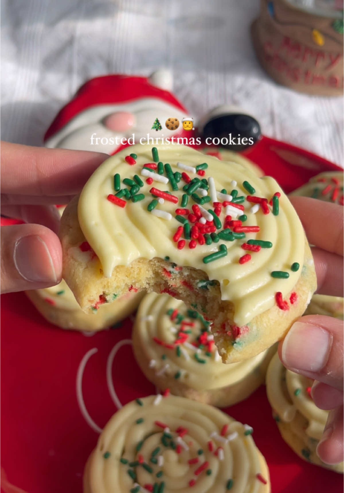 Frosted Christmas sugar cookies🍪🎄 Merry Christmas Eve🎄❤️ if you’re in need of an easy, last minute dessert for Christmas, these cookies are the perfect ones to make! Ingredients Cookie Dough - 3/4 cup unsalted butter, melted - 1/2 cup granulated sugar - 1/2 cup powdered sugar - 2 tsps vanilla - 1 tsp cake batter extract - 1 large egg - 1 egg yolk - 2 1/2 cups all-purpose flour - 1 1/2 tsps baking powder - 1/2 tsp baking soda - 1/4 tsp salt - 1/4 cup sprinkles Cream Cheese Frosting - 1/4 cup unsalted butter, room temp - 4 oz cream cheese, room temp - 1/2 tsps vanilla extract - 1/2 tsp cake batter extract - 1 1/2 cups powdered sugar - 1-2 tbsps milk  Directions - Preheat oven to 350 F. Line a baking tray with parchment paper. Set aside. - In a large bowl, whisk together the melted butter and BOTH sugars. - Add the egg, egg yolk, and extracts. Whisk until combined. - Add baking powder, baking soda and salt. Stir until combined.  - Add the all-purpose flour, 1/2 cup at a time and mix until flour is almost incorporated. Add in the sprinkles and fold until just combined. - Scoop the cookie dough and place onto the prepared pan with couple inches in between each dough ball. Slightly flatten each dough ball. - Bake for 11-13 minutes until the edges are slightly golden brown and the center no longer looks wet. - After removing from oven, allow the cookies to cool in the pan before transferring to a wire rack. To make frosting: - In a large bowl, beat the unsalted butter and cream cheese until light and creamy. - Add in the powdered sugar. Beat until creamy. Add in milk 1/2 tbsp at a time until you reach your desired consistency. - Pipe or spread frosting on top of the cooled cookies! - Store in an airtight container in the refrigerator for 3-4 days. #christmasrecipe #bakingszn #christmascookies #cookiesoftiktok 