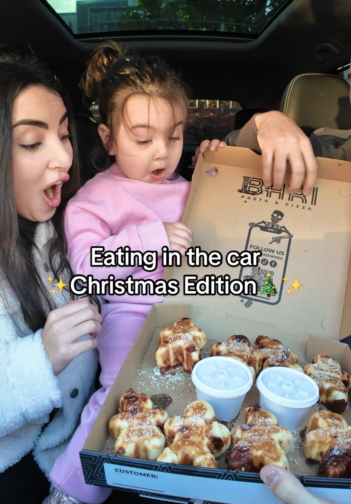 We love enjoying meals in the car with our kids 😊 this time we shared the most delicious cheesy gingerbread we've ever had. It was a little hot at first for Alita, but once it cooled down, we all savored every bite. Merry Christmas everyone!🎄🫶🏻 #fyp #viral #family #toddler #baby #MomsofTikTok #dadsoftiktok #parentsoftiktok #cute #christmas #gingerbread #food 