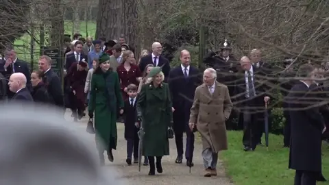 The Prince and Princess of Wales led the glamorous arrivals as the royal family gathered at St. Mary Magdalene Church on the Sandringham estate today. King Charles and Queen Camilla wrapped up warm for the event, waving to well wishers as they strolled into the service ahead of other members of The Firm. Catherine walked side by side alongside her husband, Prince William, whilst Prince George, Princess Charlotte and Prince Louis were smartly dressed in coordinating colours. Other senior royals and family members also attended the service, adding to the occasion’s grandeur, including Princess Beatrice, Lady Louise Windsor and the Duchess of Edinburgh. The gathering marks a continuation of a long-standing royal tradition, emphasizing family unity during the holiday season. #royals #britishroyals #Sandringham