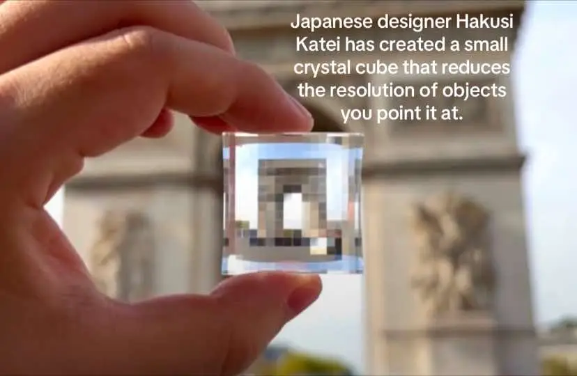 Japanese designer Hakusi Katei has created a small crystal cube that reduces the resolution of objects you point it at.