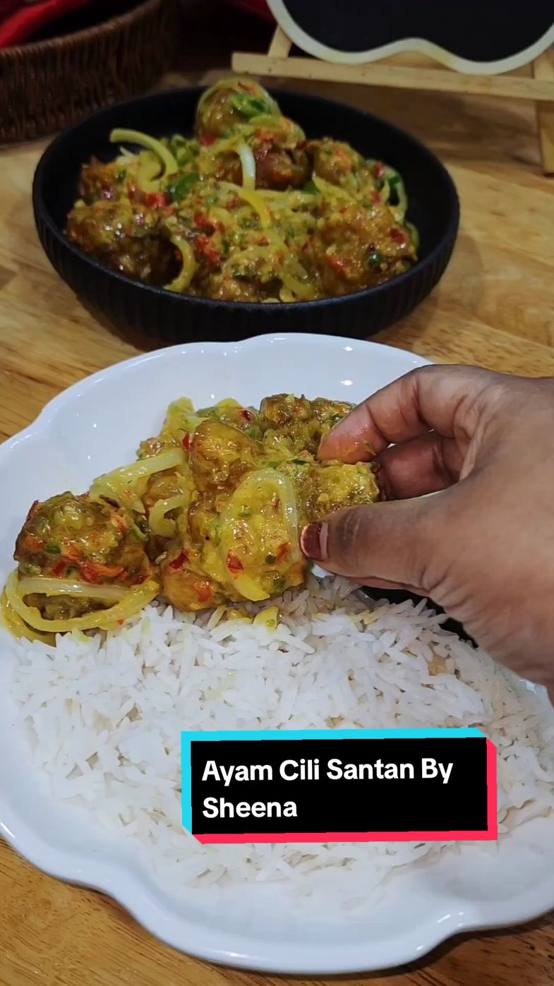 Hello all, Today we are making Ayam Cili Santan, I hv been seing this recipe  on Tiktok .So, I made it my version today. Originally the recipe is similar to ayam masak lemak cili padi, but I cut a few ingredients and wanted to make this as simple as I cn. This  tasted more like a different version of buttermilk chicken . You must try this recipe. Selamat mencuba 🤗 Ayam Cili Santan By Sheena Ingredients :- 2 small red onions 5 cloves of garlic 3 red chili 3 green chili 15 cili padi Chop all above together. 1 kg chicken (marinated with 2 tbs turmeric powder and salt) 1 yellow onion 1 green chili 1 red chili 1 tbs oyster sauce 1 cup thick coconut milk Salt Some sugar Method :- 1. In a pan, heat up oil and fry chicken till its fully cooked 2. Strain from oil and keep aside 3. In another pan, add in some of the oil your fried chicken and heat up 4. Add in chopped ingredients, mix well snd let oil split 5. Add in oyster sauce, salt and sugar 6. Mix well and add in coconut milk 7. Stir well and add in fried chicken 8. Stir occasionally for 5 minutes till it gets thicken. 9. Finally add in yellow onion, green chili and red chili 10. Mix well and off the heat 11. Ready to serve. #Foodie #foodstagram #foodblogger #reels #reelsofinstagram #sheenarecipes #sheenacookingpassion #instafood #instarecipes #cookingislove #cookingram #cookingreels #homecook #malaysianblogger #MalaysianFood #instablogger #fyp #tiktokmalaysia #tiktokmalaysia🇲🇾 