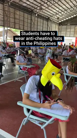 These students in the Philippines were forced to wear hilarious anti-cheating hats for their exams.   The pupils, who study agriculture, even had to make the impressive headgear themselves.  Which is your favourite? #philippines #philippinestiktok #asia #student #lifehacks #hack