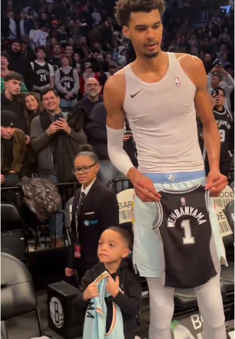 Wemby holding that jersey 😅 (via @San Antonio Spurs) #NBA #basketball #spurs #wemby 