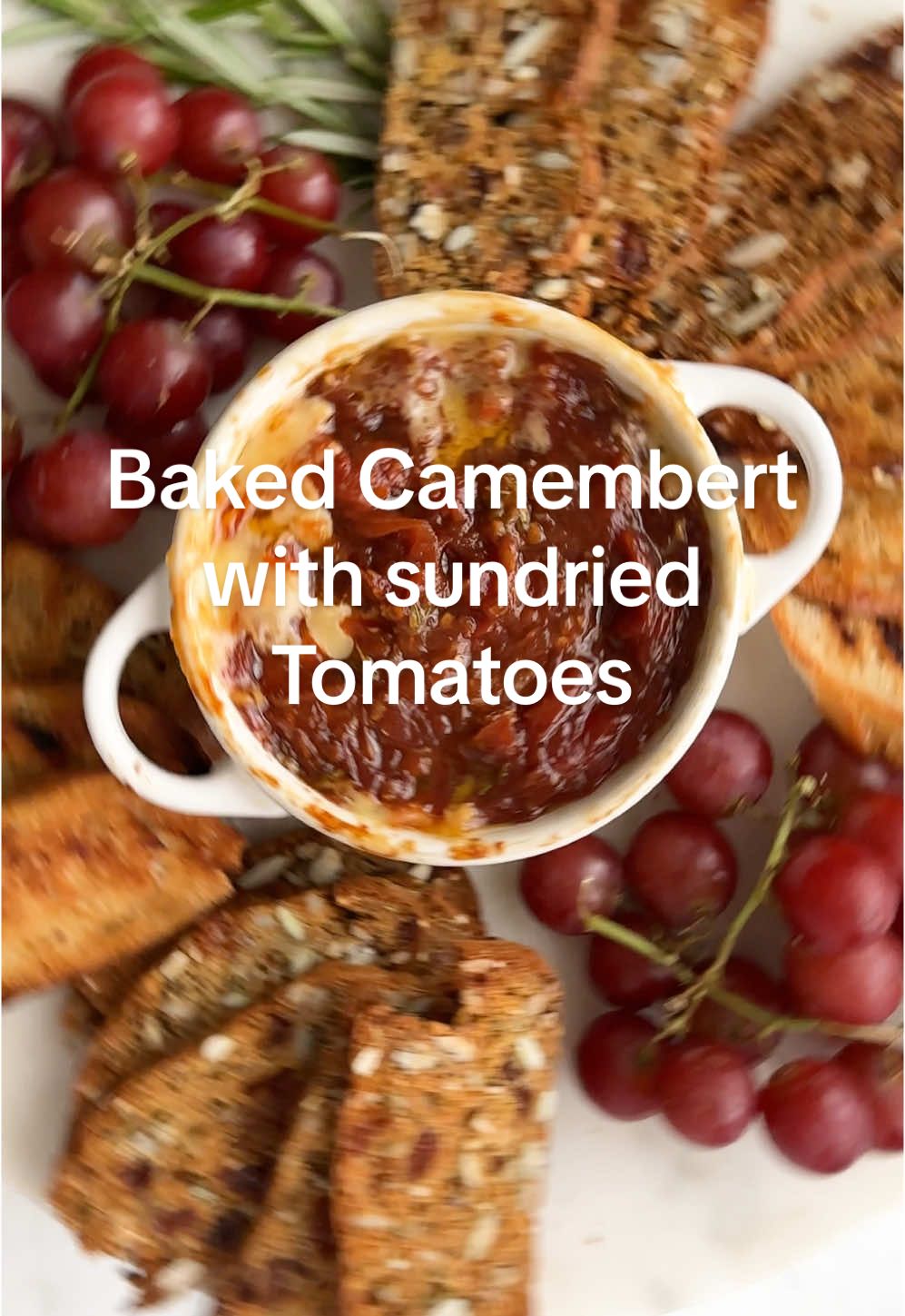 This is the best-baked camembert with sundried tomatoes, and it’s always a huge hit when I make it for people. It can be assembled in less than 5 minutes and baked in around 20-25 minutes. Serve with toasted baguette slices or crackers.
 
 If you prefer, you can use Brie for this recipe—it's a perfect low-maintenance party appetiser for New Year’s Eve.
 
 The full recipe is on my website, linked in my profile.
 
 
 
 
 #Recipe #camembert #appetizer #bakedcamembert 