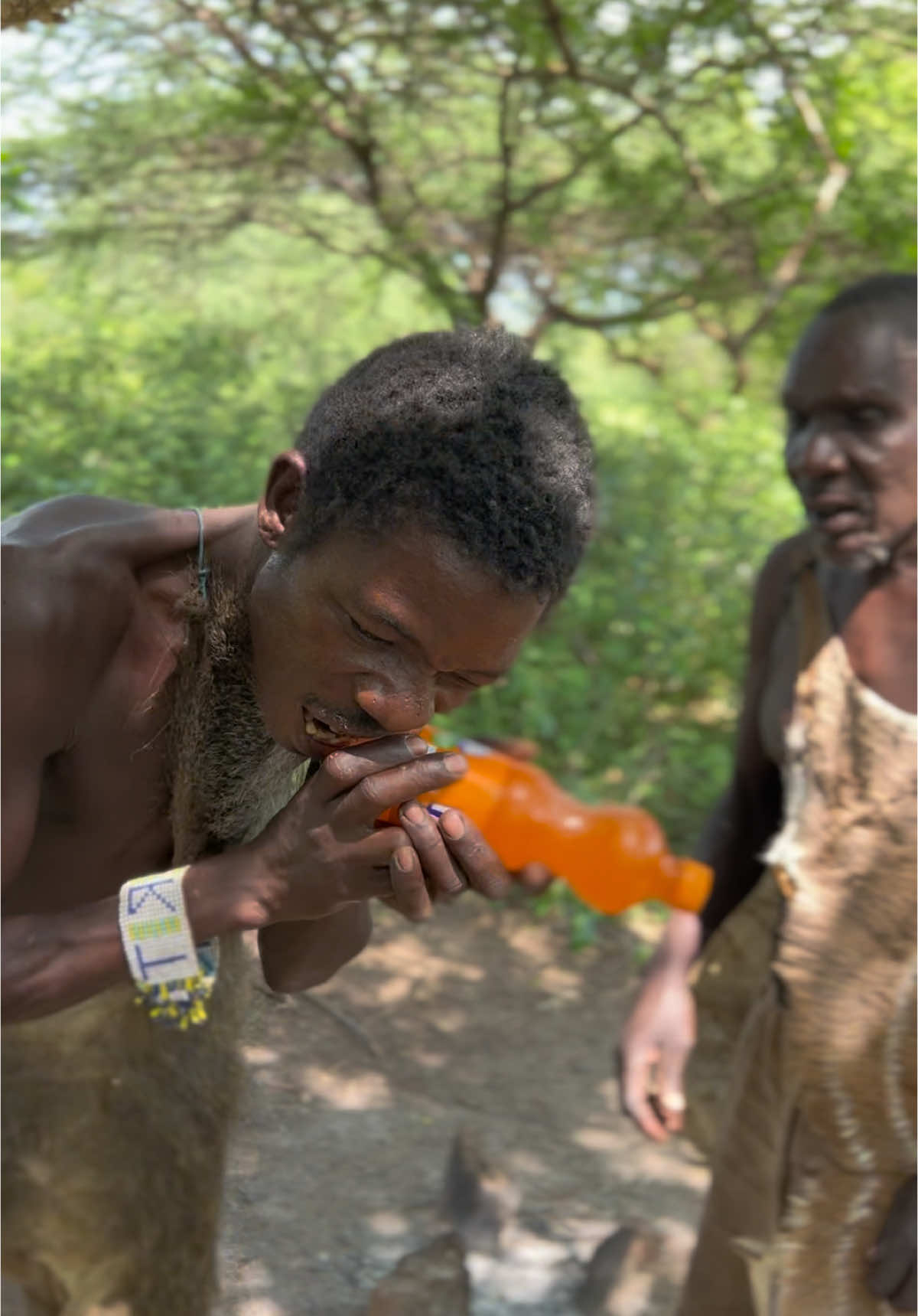 HADZABE DRINKING FANTA FOR THE FIRST TIME 😂😂😂. Should @Coca-Cola add user manual on the bottle? 😂😂 #fanta #cocacola #hadzabetribe #tribalheritage #cocacolachallenge #tiktokindia_ #tribalheritage #mukbangeatingshow #tiktokindia_ #fypp #tiktokindonesia 