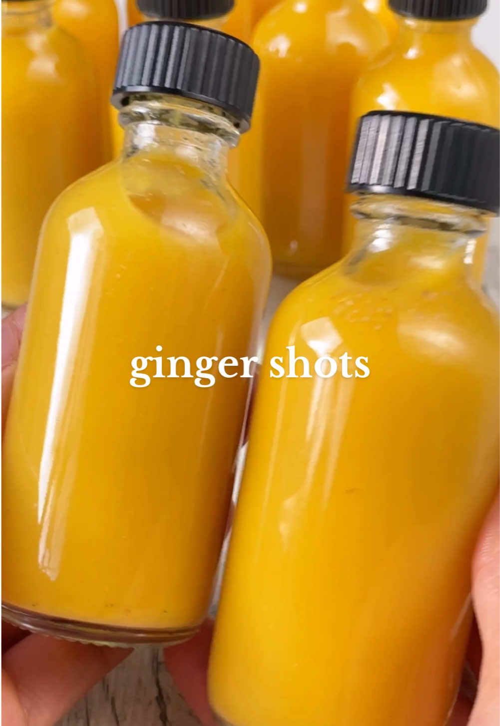 GINGER SHOTS 🫚🍋✨ Let's kickstart 2025 by making our own immune boosting shots at home! 👏 I've seen these being sold at cafes for $7+ PER shot and they're actually so easy (and much cheaper) to make at home! Ingredients:  2 oranges 2 lemons Fresh ginger to taste (start with 50g, add more or less depending on how strong you want it to be)  1/2 tsp ground turmeric 1/8 tsp black pepper 2 cups water OR coconut water if using a blender (skip if using a juicer)  Optional: 1-2 tbsp liquid sweetener of choice  Method:  1. Peel your oranges and lemon and cut into smaller wedges.  2. Wash your ginger well and cut into chunks.  3. Add all of the ingredients into your juicer. Alternately, add into a blender with the water or coconut water, pop the lid on and blend on high until smooth. Pour through a sieve and into a large bowl. Use a spoon to help filter the juice through. Alternately you can also strain it through cheesecloth/a nut milk bag instead for a smoother juice.  4. Place the funnel on top of your glasses and carefully pour in the juice. Repeat until you’ve used it all up. Pop the lid on all of them and place into the fridge to chill. Enjoy! 👏 NOTE: They will last in the fridge up to 1 week, but ideally are best consumed within 3-5 days. You can also freeze them and thaw out as needed so they last longer (just don’t fill up the bottles too high up).  #vegan #plantbased #EasyRecipe #healthyrecipe #ginger #gingershot #juice #juicerecipe #lemon #health #juicing #healthyfood #gingerlemon #wellnessshot #healthyfood 