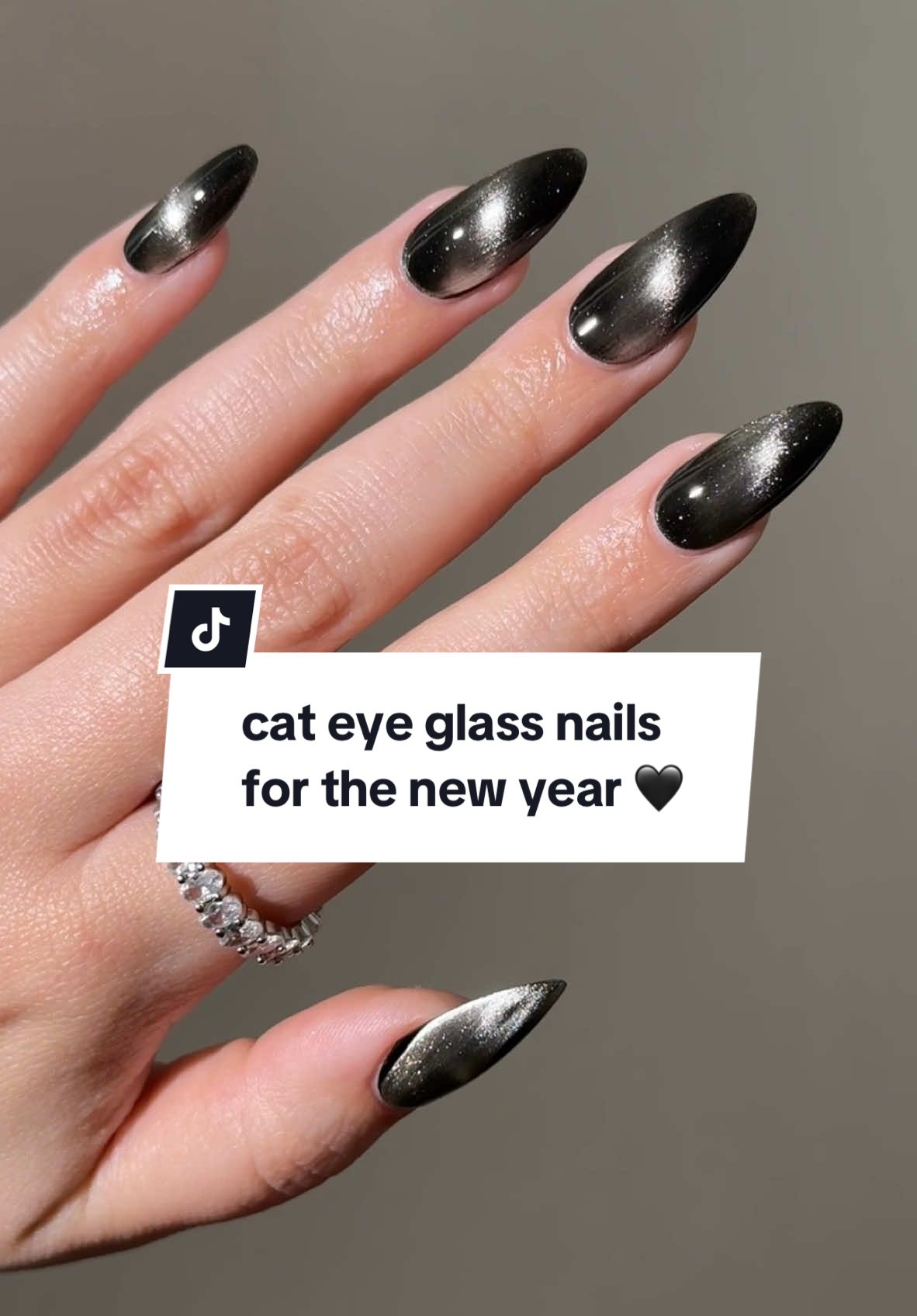 cat eye glass nails for the new year 🖤 products used: tuxedo mask, starfall, magnetic magic wand, & totally gelly.  #cateyenails #glassnails #nailinspo #newyearnails #nailart #diynails #diynailsathome 