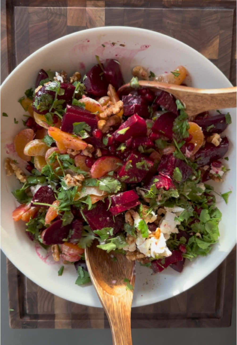 Ringing in the new year with some of Januarys finest; beet, orange and pomegranate combine to make an exceptionally nourishing salad that is as equally delicious as it is beautiful 🤍   It will leave you feeling vibrant, healthy and full of life!  Ingredients: -4 medium beets -8 mandarin oranges  -seeds of 1 pomegranate  -1 cup chopped cilantro  -1/4 cup chopped walnuts  -crumbled goat cheese For dressing: -juice of 1 lemon -1/4 cup olive oil -1 tsp. kosher salt -1 tsp. black pepper  Directions:  Begin by peeling, halving, and steaming your beets until fork tender (about 35-45 minutes).  Meanwhile, peel your oranges into individual slices and remove seeds from your pomegranate. Add to a large bowl.  Once beets are steamed, run under cold water to cool slightly. Then, slice into bite sized cubes. Add to the bowl with your oranges and pomegranate.  Chop your cilantro and add to the bowl, followed by your walnuts and goat cheese.  To make the dressing, combine all ingredients in a small bowl and whisk vigorously to combine.  Drizzle overtop of your salad, then toss to combine. Enjoy!  #beets  #mandarin  #pomergranate  #seasonalproduce  #newyearsresolution  #healthyrecipes  #saladrecipe  #healthysalad 