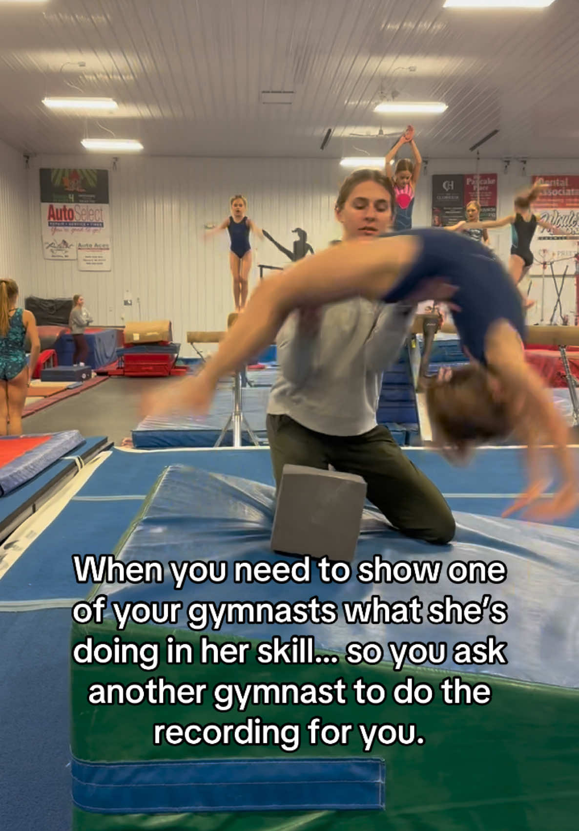 Sometimes as a coach you need to record your gymnasts to show them the video…but when you also need to be there to spot the skill, you have to ask your other gymnasts to help you out and run the camera 🤗 #gymnastics #trending #gymnasticstiktok #fyp #GymTok #gymnasticscoach 