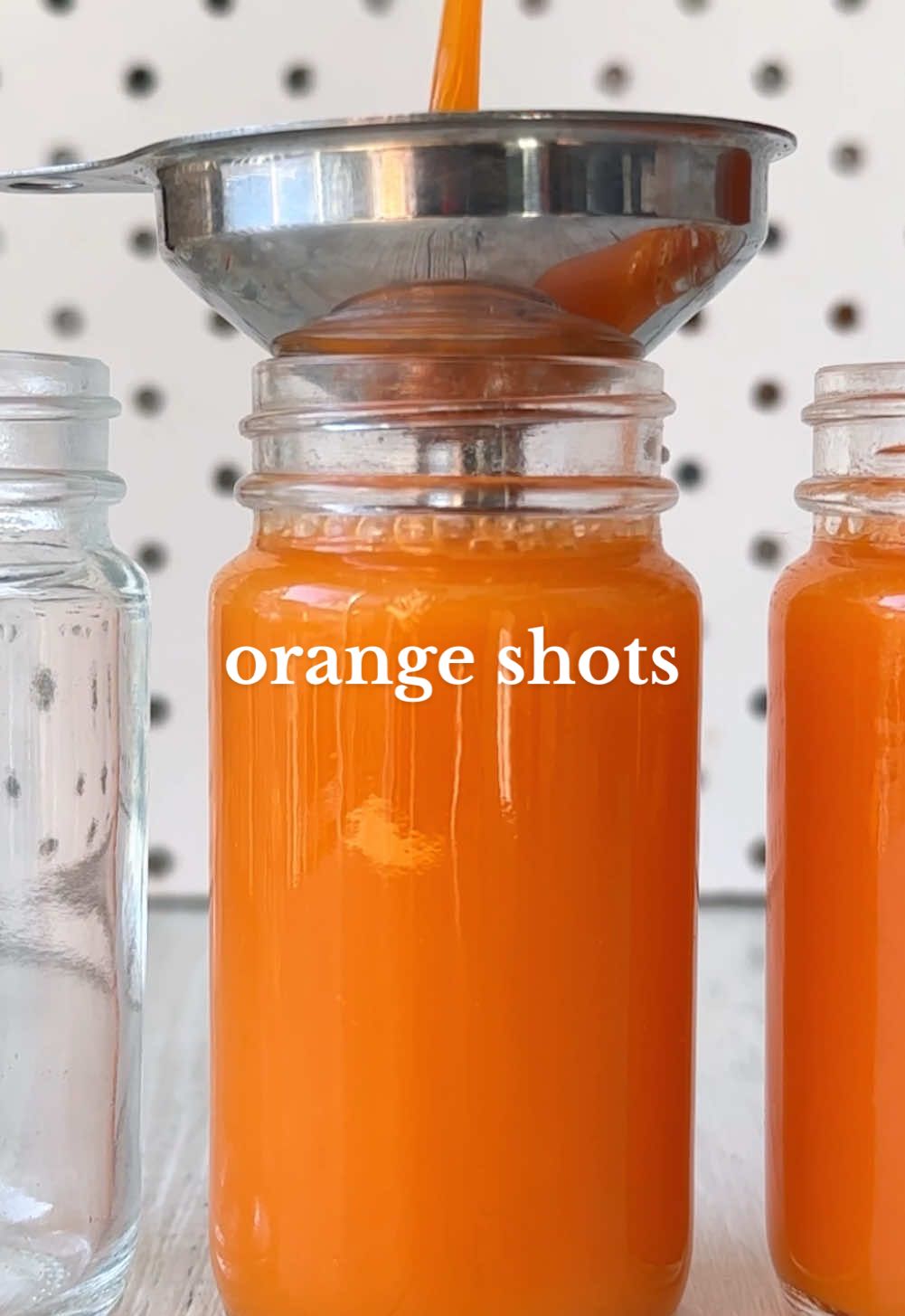 ORANGE SHOTS 🧡🍊🥕🫚 Let's kickstart 2025 by making our own juice shots at home! ✨ Plus, if you find lemon ginger shots too strong, these are perfect since the orange and carrot both add natural sweetness to balance out the ginger nicely 😊 Ingredients:  8 carrots  6 oranges  Chunk of fresh ginger, to taste (start with about a thumbs length worth and add more if you like it stronger!)  Method:  1. Wash your carrots well and slice into smaller chunks. Slice the peels off the oranges and quarter them. Use a spoon to peel the ginger and slice into smaller pieces.  2. Add into your cold press juicer. I usually start with the carrot first so I can separate the pulp and use it later, followed by my ginger and orange.  3. Place the funnel on top of your glasses and carefully pour in the juice. Repeat until you’ve used it all up. Pop the lid on all of them and place into the fridge to chill. Enjoy! 👏 NOTE:  ✔️ These are best consumed within 3-5 days. You can also freeze and thaw out as needed so they last longer  ✔️ If you don't have a juicer you could blend this mixture but you'd need to add water or coconut water then strain well. It will dilute the juice but it still works #vegan #plantbased #EasyRecipe #healthyrecipe #ginger #gingershot #juice #juicerecipe #orange #health #juicing #healthyfood #wellnessshot #healthy #orangejuice #juiceshot #healthyrecipes 