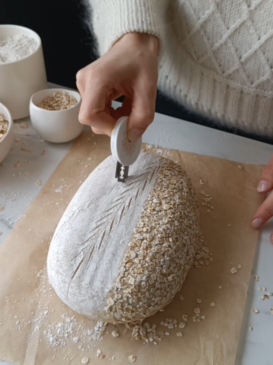 This Maple Oatmeal Bread is so so tasty! It combines the natural tanginess of sourdough with the sweet warmth of maple syrup and the nutty essence of oats 🤎 This bread has a soft tender crumb and a delicious crispy golden-brown crust. You can use honey instead of maple syrup!  Recipe in my ebook Mastering the Art of Gluten-Free Sourdough Baking.  #glutenfreesourdough #sourdough  #sourdoughscoring #glutenfree 