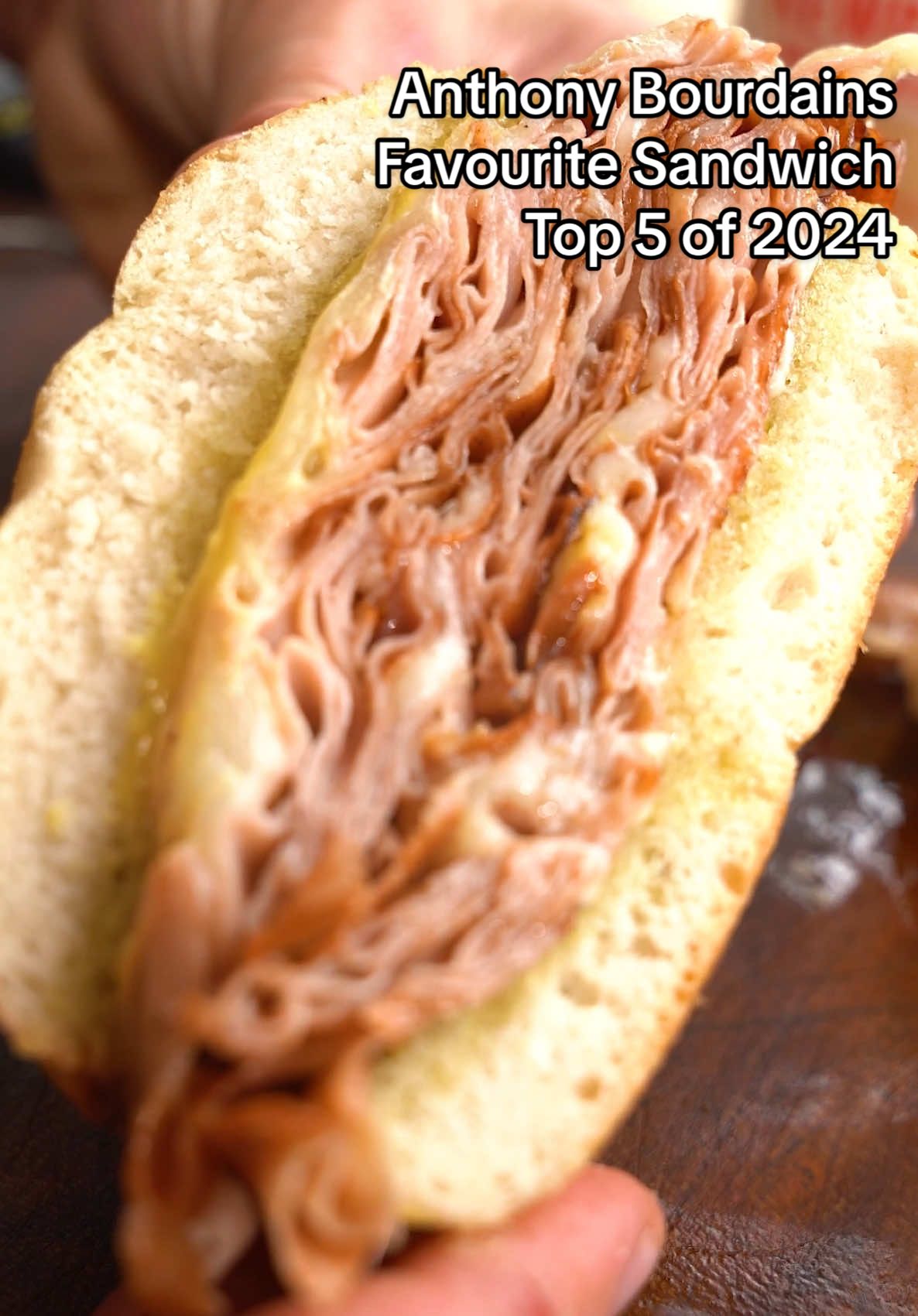 Anthony Bourdain’s Favourite Sandwich - My Top 5 recipes of 2024 - No.1 Ingredients: 9 pieces Mortadella  2 tbsp Olive Oil 3 slices Provolone 1 white bun 1 tbsp mayonnaise  1 tbsp Dijon mustard Method: Heat a large frying pan with a little olive oil. Scrunch and fold up 3 pieces of mortadella and fry separately on both sides until crispy. Then stack the fried mortadella, slice the provolone and place it on top of the mortadella. Add a splash of water to the pan and cover it until the provolone melts. Repeat this process twice more and place on top of the other fried mortadella and cheese. Slice and toast your bun in the same pan with a little olive oil. Once toasted, spread mayonnaise on the bottom half and Dijon mustard on the top half. Place the stack of mortadella and melted cheese on the bottom bun, then add the top bun. Enjoy! #sandwich #mortadella #provolone #cheese #anthonybourdain #sandwiches