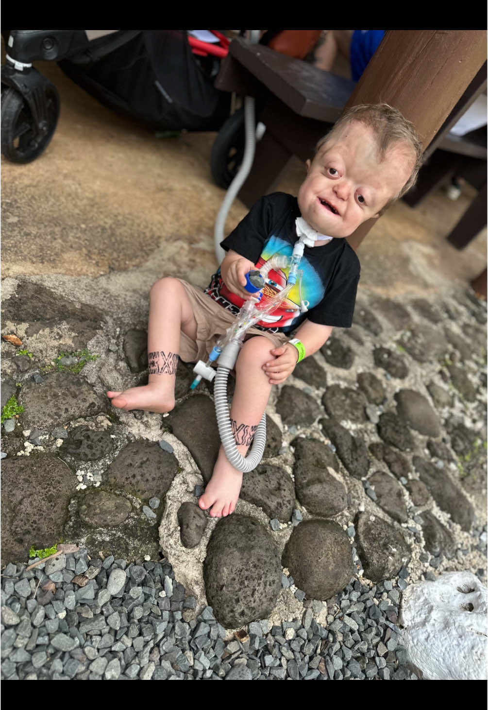 Day 2 in Hawaii 🌴 Visit through the Polynesian Center! Definitely a memorable experience! 💜 Raedyn embraced his inner island boy and ran around all day with no shoes! Played with rocks and tried coconut milk! #risewithraedyn #christmas2024 #christmasinhawaii #honoluluhawaii #polynesiancenter #traveltiktok #medicallycomplex #travelingwithkids #pfeiffersyndrome #trachbaby #craniofacialdifference #bekind #trachbaby #specialneedsmom 