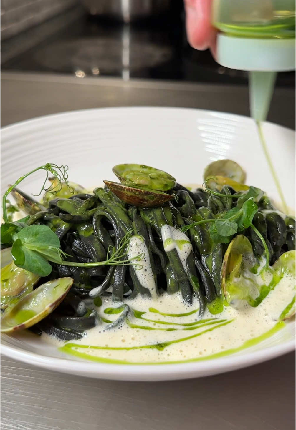 The pasta water won’t be the only thing wet tonight #pasta #vongole #clams  What’s for dinner baby? Cuttlefish ink linguine Vongole with butter, parsley, garlic, and spinach and Vongole emulsion.  Will I like it?  This pasta was a bit of a gamble, but it turned out wonderful. It has the elements of pesto pasta but with a seafood spin. Taste 9/10.  Recipe link in bio. 