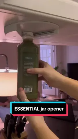 Struggling to open jars in the kitchen? Say goodbye to the struggle with this under-cabinet jar opener! Buy now at https://oazisgear.bigcartel.com/product/under-cabinet-jar-opener #kitchenorganization #cabinetorganizer #jaropener #underCabinetStorage #KitchenHacks #kitchentips #homehacks #kitchentools #kitchenessentials 