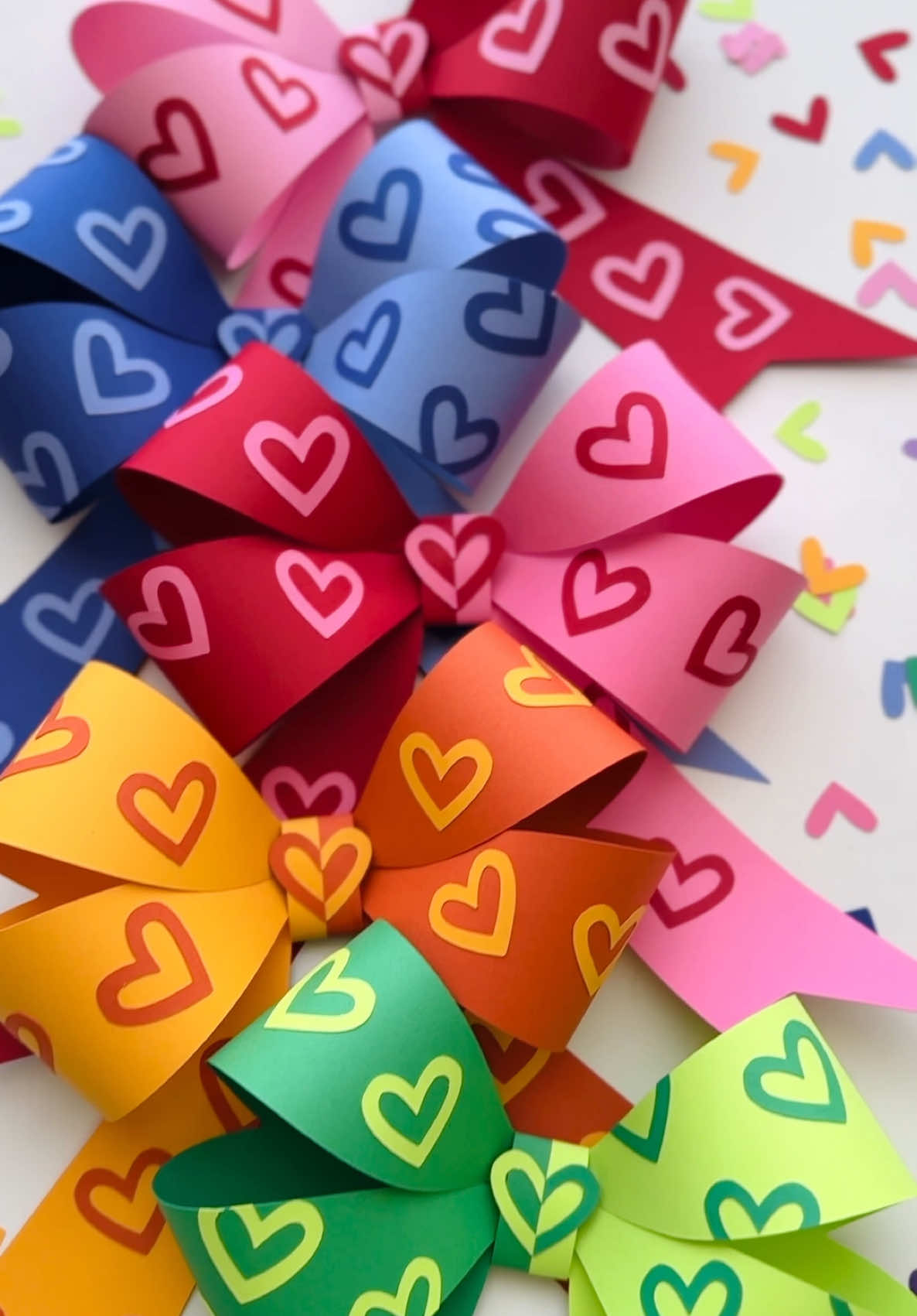 Add a little love to your crafts with these cute two-tone paper bows! ❤️🎀  Perfect for that sweet handmade touch to your Valentine’s Day decor, cards, gifts, and more!🫶 #papercraft #paperbow #crafttherainbow #crafttherapy #floralflairtemplates #craftymom #valentinesdaycrafts #valentinescrafts #bows #papercrafter #coquette #coquettecore #diyvalentines #handmadewithlove 