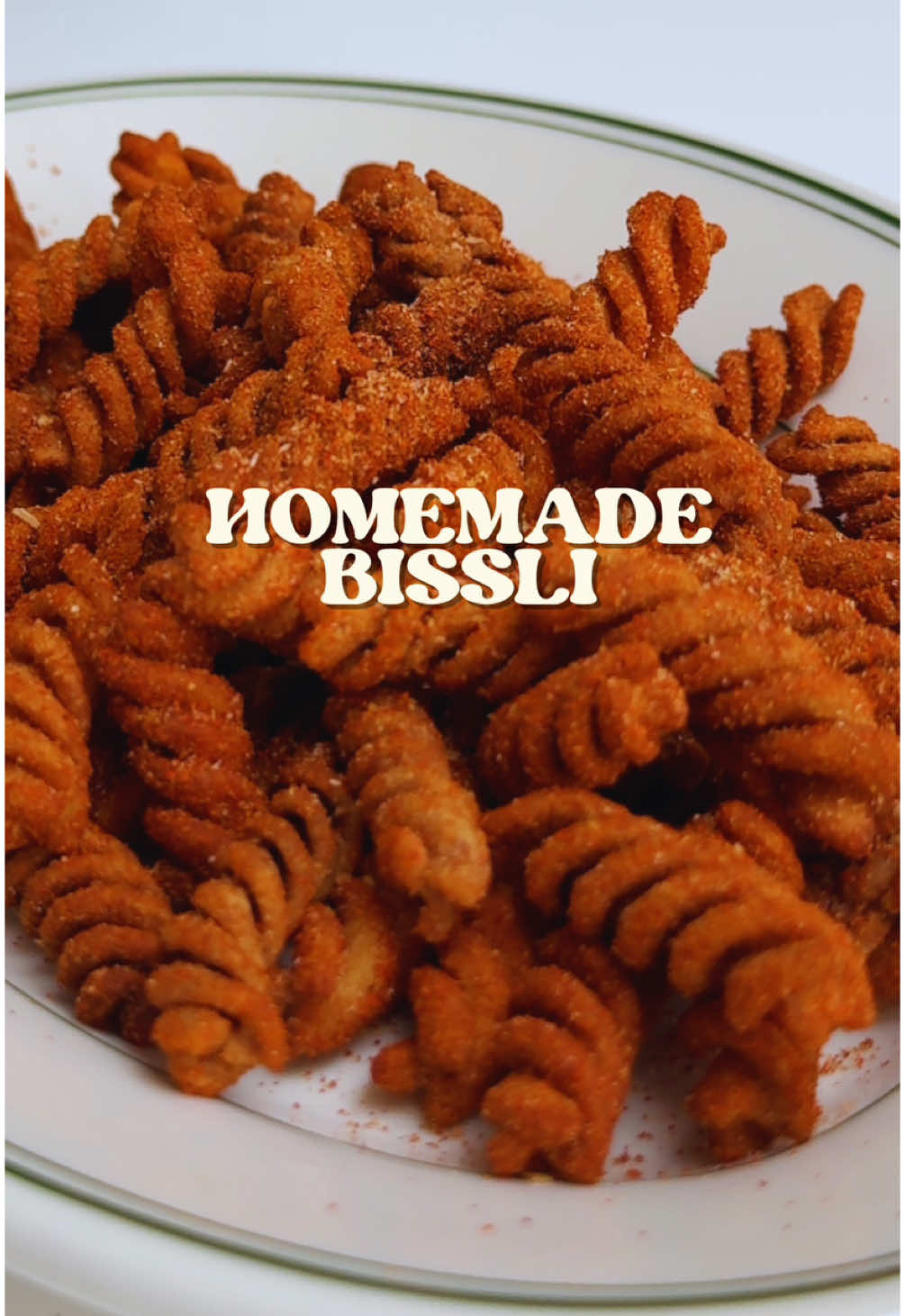 Veganuary day 5  🇮🇱 Homemade Bissli 🇮🇱 Sorry Osem, these are the new bad boy on the block. You have to try these grill flavoured homemade Bissli. Crunchy, flavourful and fun to make, they’re perfect.  Shoutout @unclelouskitchen for the inspo give him a follow for sure!  Ingredients 200g fusili pasta 1 tsp  smoked paprika 1 tsp  onion powder 1 tsp  garlic powder 1 tsp ground cumin 1 tsp  ground coriander 1 tsp  Sugar 1 tsp  MSG 1 tsp salt Boil salted water for the pasta and add a bit of oil to stop the pasta sticking together  Cook according to packet instructions but you want to go just past the al dente stage with the texture  Drain and dry the pasta out - water and hot oil do not mix well I tried two methods for frying: For deep frying, heat the oil in a pan and add a few pieces of pasta at a time  They’ll puff up and go golden in about 1 minute  For air frying, spread them out and spray with some oil. I actually overcooked mine by about a minute as I forgot about them but air fry for about 8-10 minutes or until desired consistency  Mix your spices in a bowl and toss the cooked pasta  I preferred the look of the deep fried but the texture of the air fried (if I didn’t overdo them) but they’re both as nice as each other  #vegan #veganuary #plantbased #bissli #israel