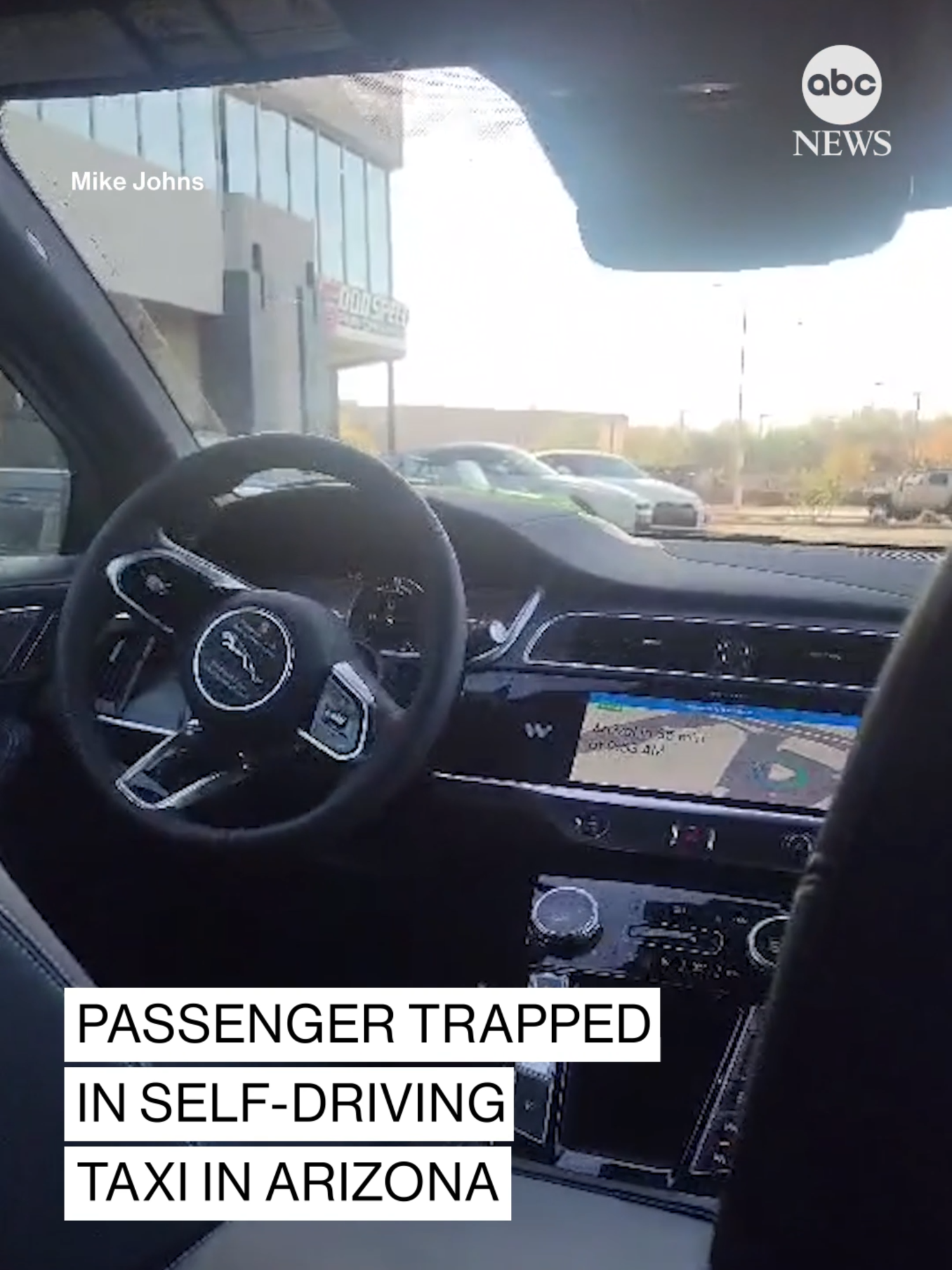 A passenger was trapped in a self-driving taxi on the way to the Phoenix airport — and he recorded footage of his ordeal from the backseat. ABC partner station KNXV reports Waymo's autonomous vehicle was apparently confused in a traffic circle, going around for eight laps. Passenger Mike Johns called the company for help and a representative was able to regain control. Waymo says Johns' ride was delayed by five minutes and he made his flight. The company refunded the cab fare. #news #waymo #arizona #abcnews