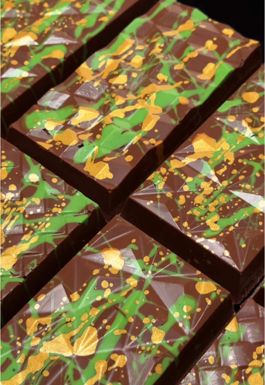 Our kunafa bars are made using the finest Belgian chocolate tempered to perfection for that mirror shine and satisfying crunch! 😍  Have you tried one yet?  #kunafabar #kunafabars #kunafe #pistachiochocolate #chocolate #pistachiobar #dubaichocolate #pistachio #chocolatier #london 