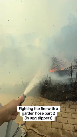 Trying to keep the fire at bay with a garden hose before LAFD shows up to save the day #hollywoodhillsfire #losangelesfire #fire #westhollywoodfire #lafd