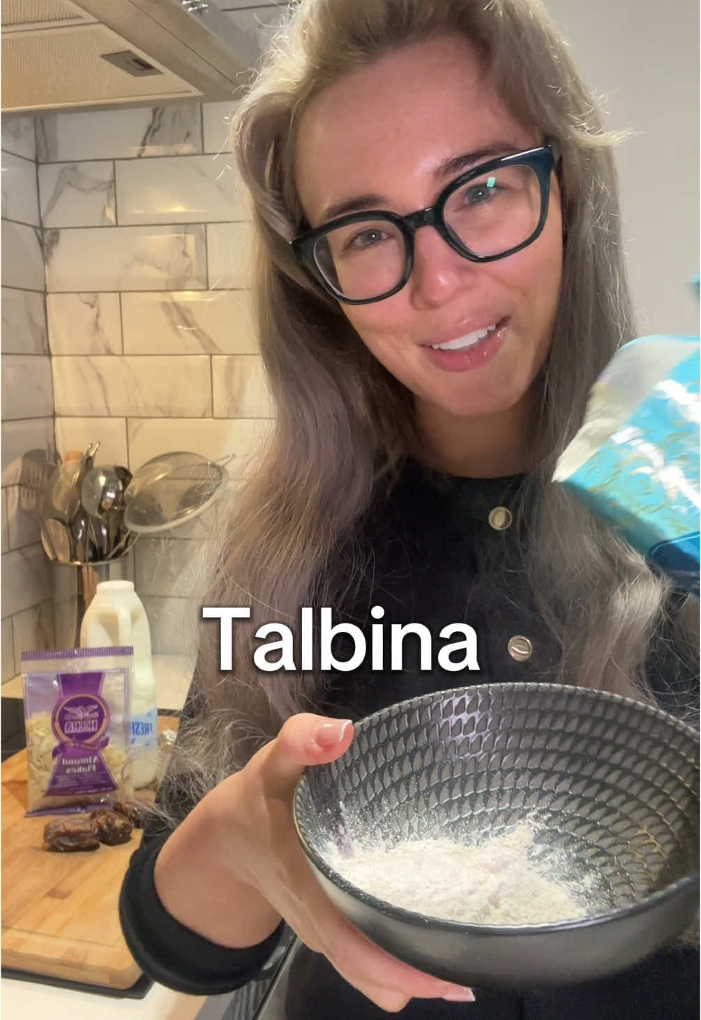 Make Talbina with me… Some studies have shown this simple Arabic dish can improve mood, relieve stress, boost brain function and support the immune system.  It is over 1400 years old and known as a ‘Sunnah’ in the Islamic faith, which means the Prophet Muhammad (PBUH) used to eat it.  RECIPE  This recipe makes one bowl of Talbina.  Double the servings for two people and so on.  INGREDIENTS  2-3 tablespoons barley flour  250ml milk (you can use any milk, I am using whole milk) 1-2 teaspoons of honey (to taste)  To garnish: 1-3 Palestinian Medjool dates & a handful of almond flakes  METHOD  1. Add barley flour and milk to a sauce pan (make sure it is one with non stick coating intact or you will burn it)  2. Put on a medium heat  3. Stir continuously until the mixture thickens (I like to use a whisk)  4. Once the mixture has thickened, remove from heat.  5. Add 1-2 teaspoons of honey to sweeten  6. Mix (I like to then use a whisk)  7. Pour into a bowl  8. Chop dates into thirds  9. Sprinkle dates and almond flakes on top to garnish  Other garnish ideas: chopped walnuts, pistachio, fruit  Have you heard of Talbina before?  #Recipe #sunnah #talbina #halal #recipesoftiktok 