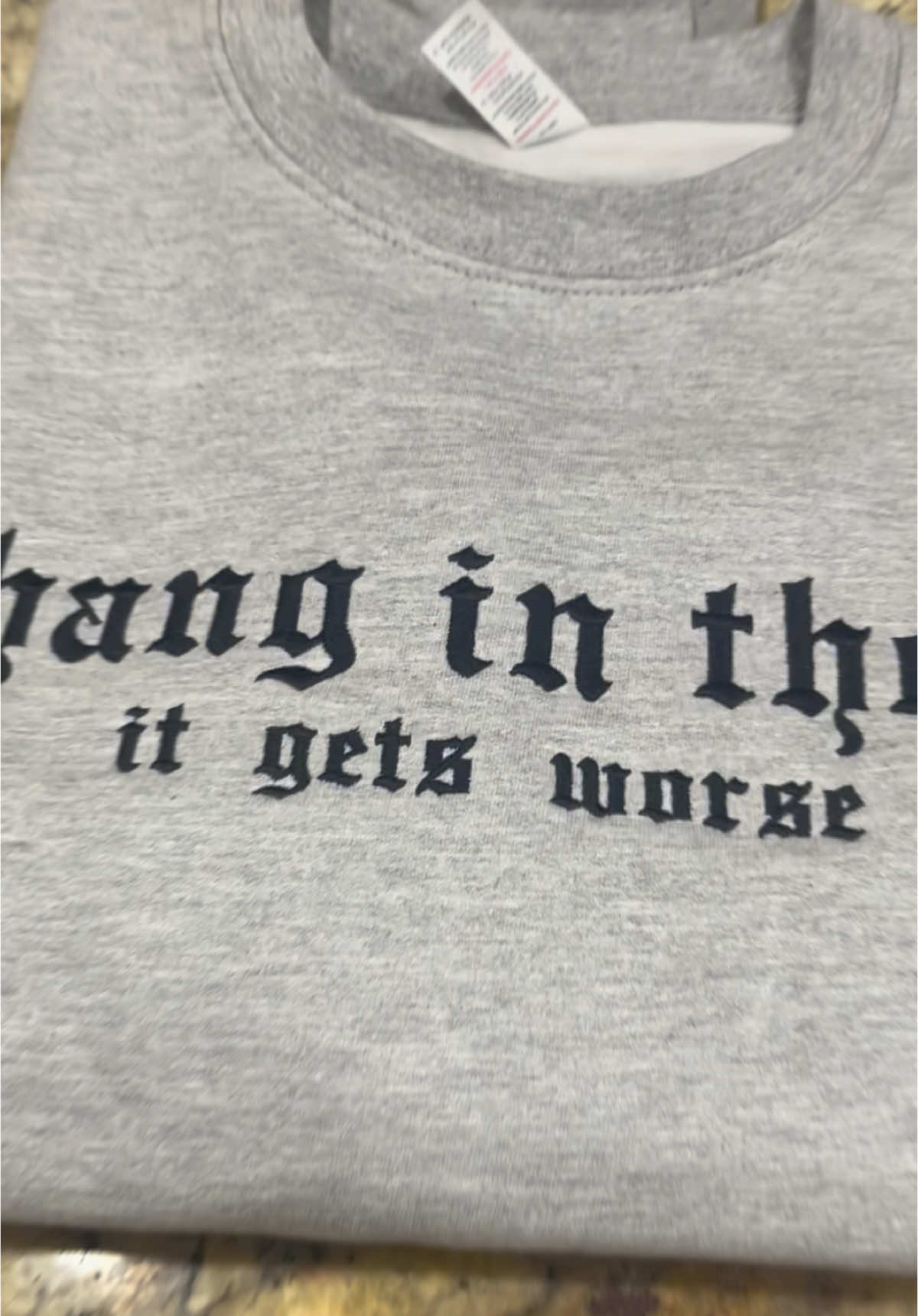 Hang in there, it gets worse! Why not deal with life’s chaos with some dark humor and style.  Grab one of these embroidered Crewneck sweatshirts. They come in multiple colors just click the cart below ⬇️ #TikTokShop #crewneck #sweatshirts #newyearnewaura #embroideredsweatshirt #altfashion #fypage @In Stitches Apparel 