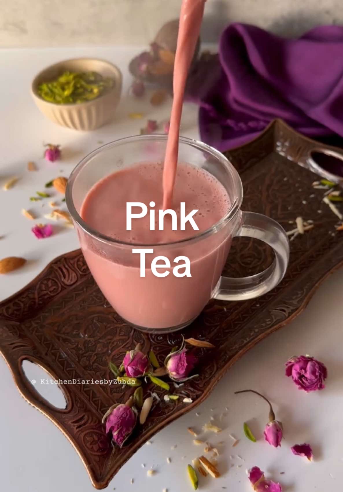 Pink Tea!    Delve into the rich heritage of South Asia with Pink Tea, a beloved beverage known for its stunning color and creamy texture.  Pink tea holds a special place in the hearts of many, especially during weddings (shaadi) .  this delightful tea combines the earthy flavors of Kashmiri green tea leaves with aromatic spices like cardamom and cinnamon. The addition of baking soda creates its signature pink hue, while a touch of milk rounds out the experience. Garnished with crushed almonds and pistachios, each cup is a celebration of warmth and hospitality. Perfect for sharing with loved ones, Pink Tea is not just a drink, it's a cherished tradition. Experience the magic today! Full recipe on my website, glass teapot link under amazon storefront. 