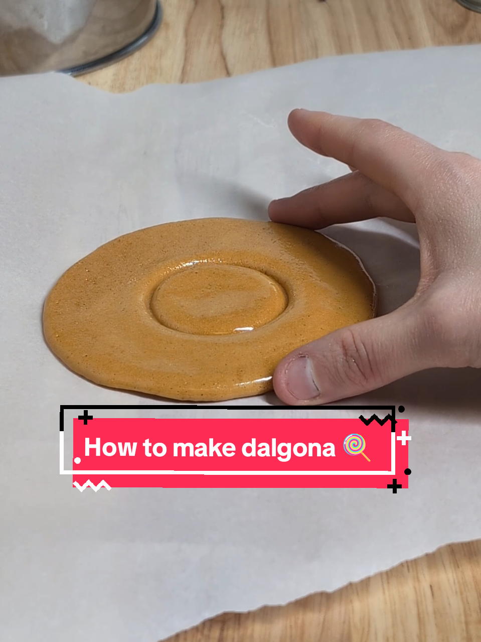 How make the  #SquidGame candy  #dalgona 🍬🍭 What you will need: 2 TBSP sugar pinch of Baking Soda  chop stick egg pan  parchment paper  solid non plastic surface  smooth metal item to press like a pot or pan  cookie cutter or etc #squidgamecandy #dalgonachallenge #dalgonacookie #DIY #tiktokpartner #LearnOnTikTok #howtomakedalgona 