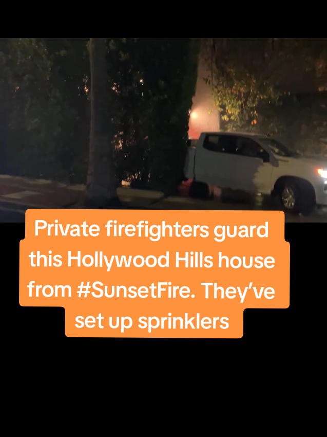 Private #firefighters guard this #Hollywood Hills house from #SunsetFire They’ve set up sprinklers to cascade water from the second story eaves #palisadesfire #California #eatonfire #SunsetFire #wildfire 