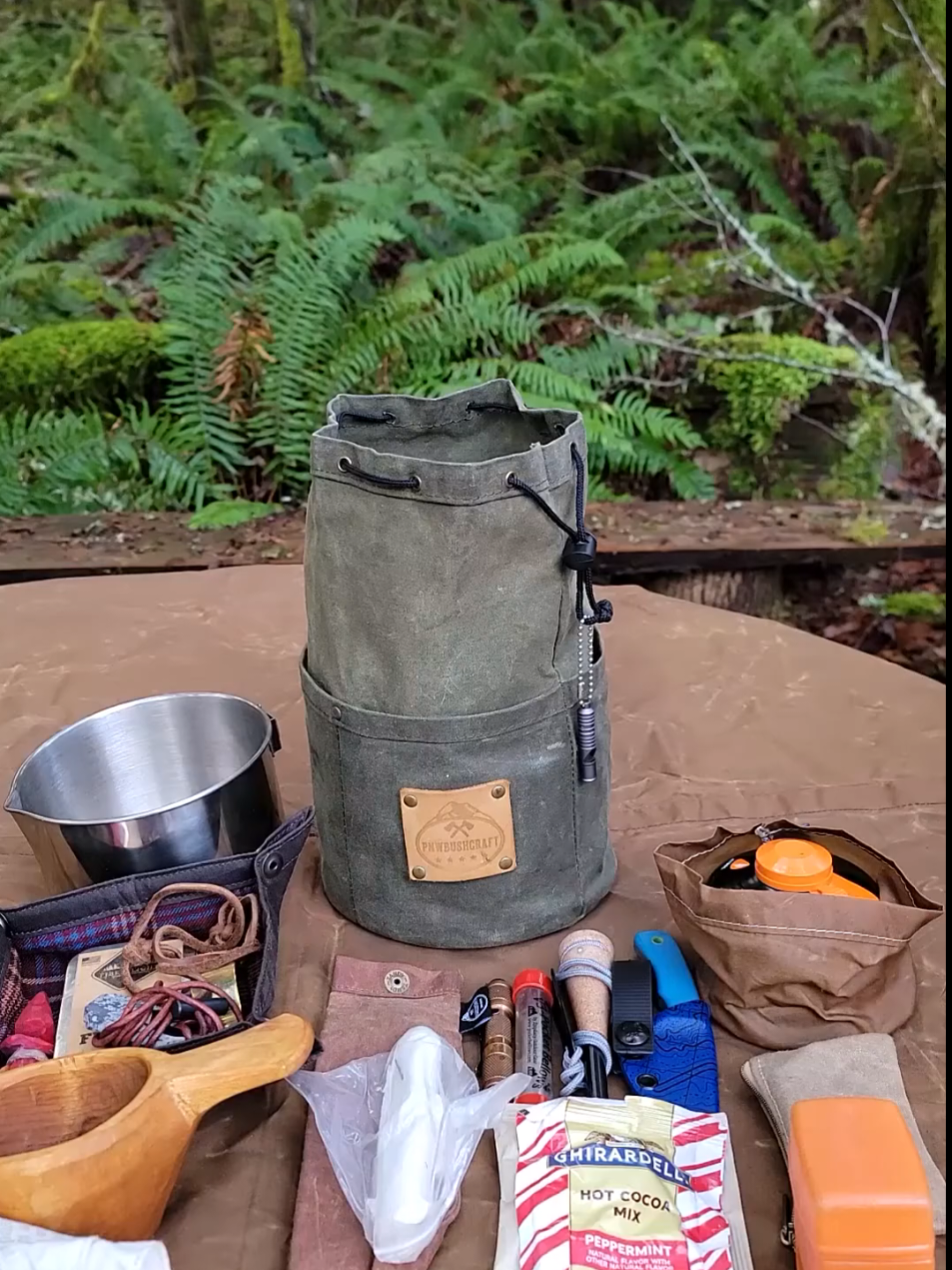 How much gear can you fit in one of our Cedar Bucket Bags? Handcrafted in Washington and ready for your next adventure #gear #camp #hike #bushcraft #outdoorcooking #pnw #waxedcanvas #pnwbushcraft 