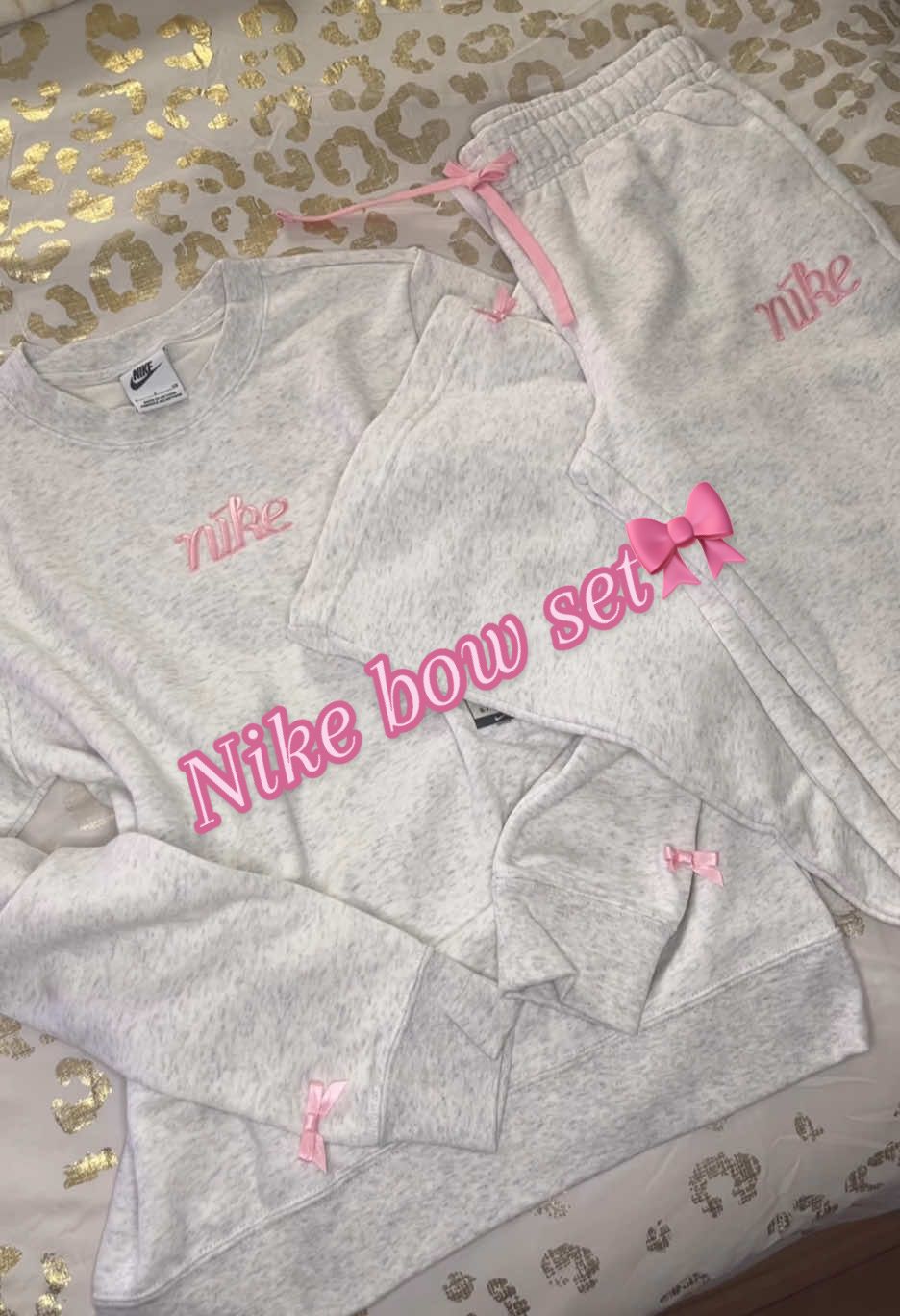 Nike just came out with a grey and pink set that has bows on it!!!🎀 it’s so coquette I love it🎀😻 Nike will be taking all of my money once I find the t shirts!!! @Nike #nike #nikebow #coquette #coquetteaesthetic #tracksuit #girlyfinds #girlythings #shoppinghaul #hauls #unboxing #viralvideo #shopaholic 