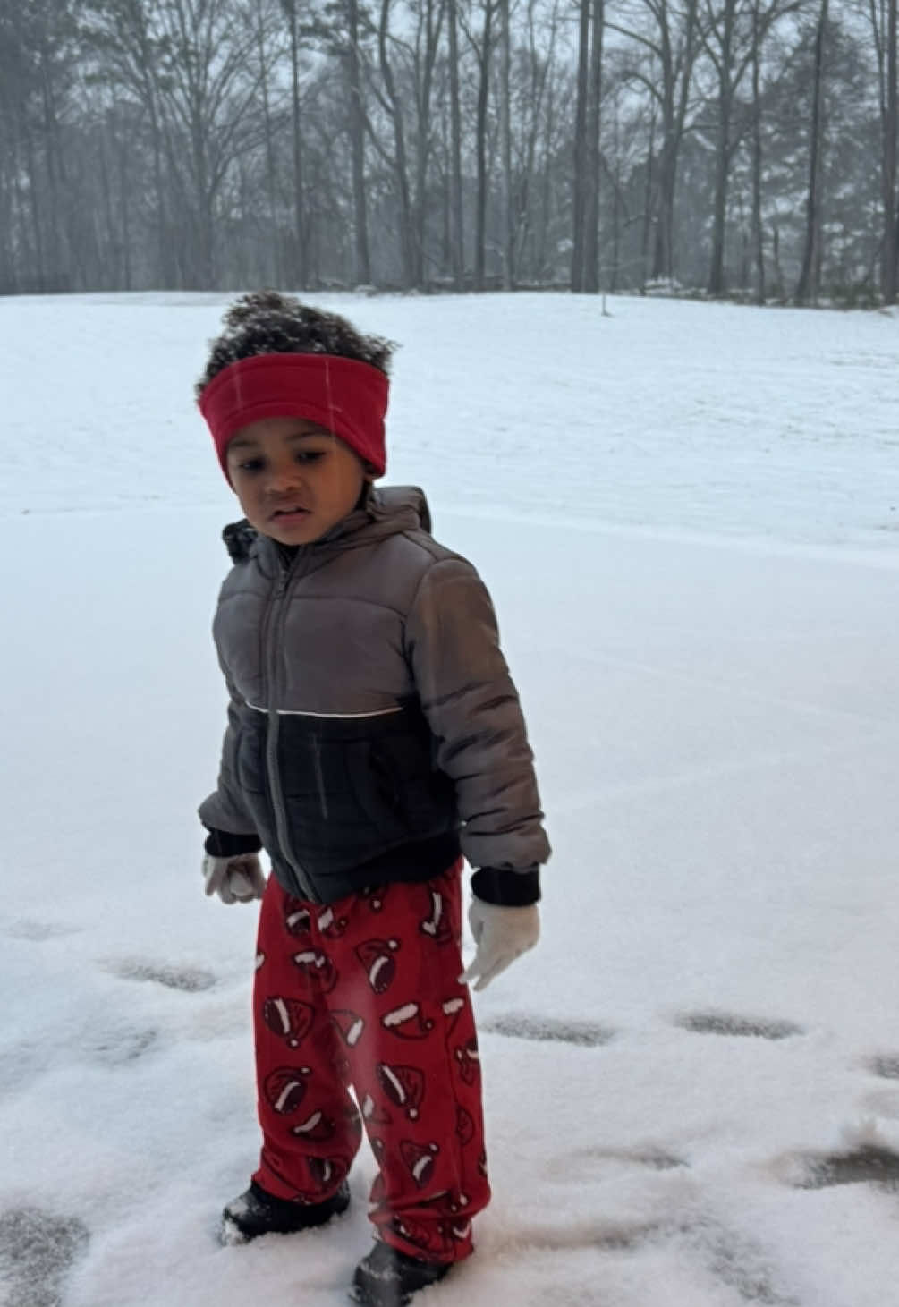 Tiaun’s first snow! #snow #snowedin #snowday #snowman #snowfall #toddlersnow 