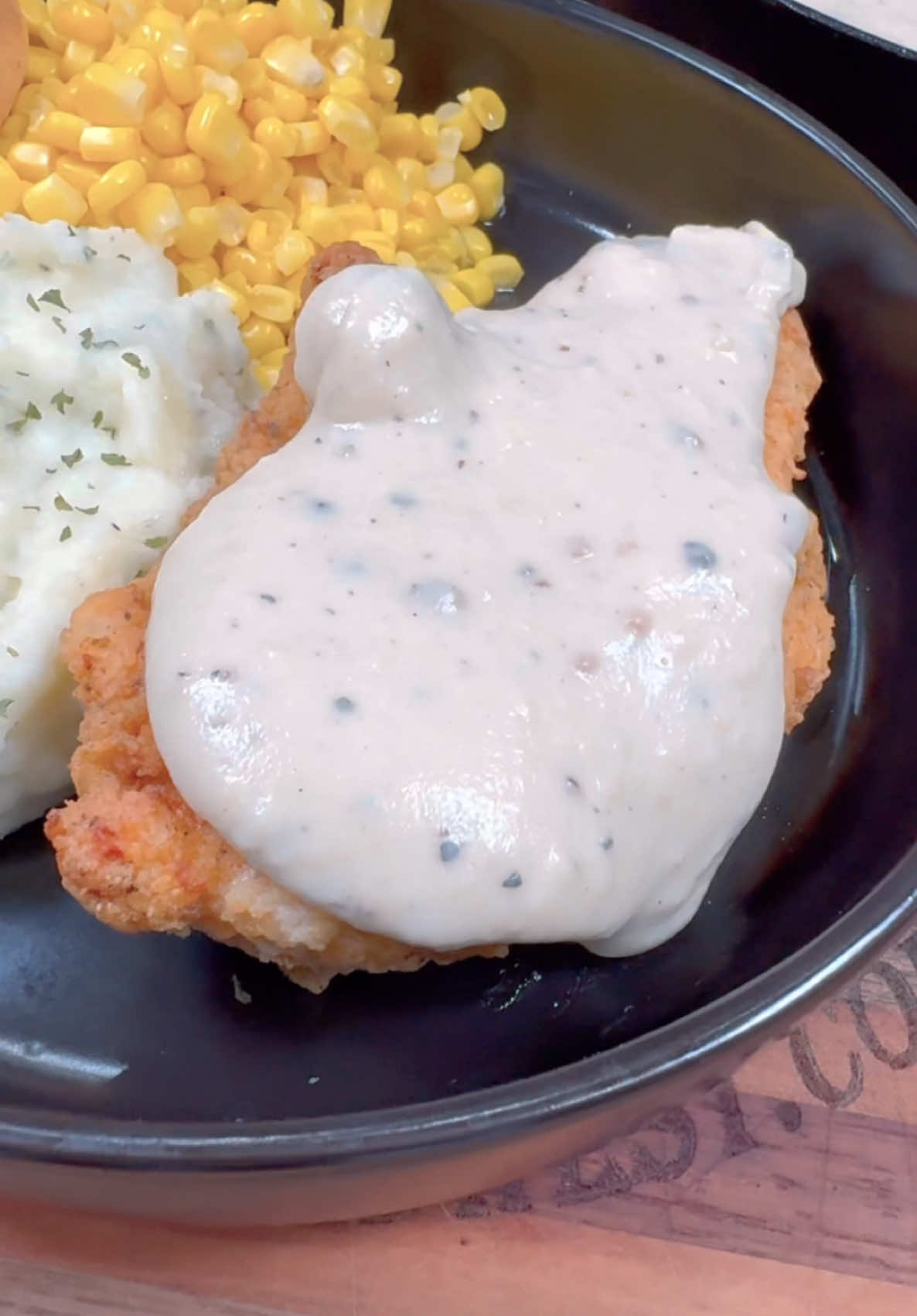 Country Fried Chicken is one of my favorite meals!  INGREDIENTS  1 pound chicken breast  salt, pepper, garlic powder 2/3 cup of oil (or more if needed)  1 cup of flour 2 tsp each of salt, pepper, paprika, garlic powder, and steak seasoning (for flour mixture)  1 cup of milk 1 egg GRAVY 1/3 cup of grease from frying the chicken 1/3 cup of flour  3 cups of milk  salt and pepper to taste  INSTRUCTIONS Cut chicken breasts in half lengthwise to make them thinner. Season chicken on both sides with some salt, pepper, and garlic powder.  In a pan heat oil over medium heat. While the pan is heating up mix together 1 cup of flour, 2 tsp each of salt, pepper, paprika, garlic powder, and steak seasoning.  In a separate bowl or container mix together 1 cup of milk and 1 egg. Dredge chicken in flour mixture, egg mixture, and back in the flour mixture.  Once the oil is hot fry the chicken for a few minutes on each side until they are golden brown and reach a temperature of 165 degrees F with a meat thermometer.  Remove the chicken from the pan and pour out all but about 1/3 cup of the grease. To make the gravy add 1/3 cup of flour to the grease making a roux. Once grease and flour are well incorporated add 3 cups of milk and keep stirring constantly. Add salt and pepper to taste. Once thickened serve over fried chicken.  #dinner #Recipe #mealideas #gravy #chickenfriedchicken 