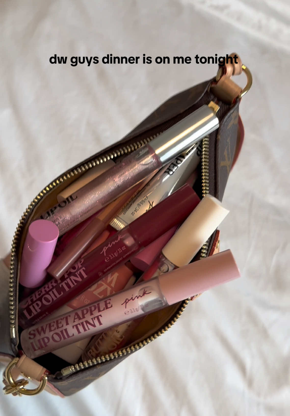 Oops sorry… forgot my wallet. Can I interest you in a lip oil?  #vspink #beauty #lipoil #dinner #whatsinmybag #lipstick #purse #bag 