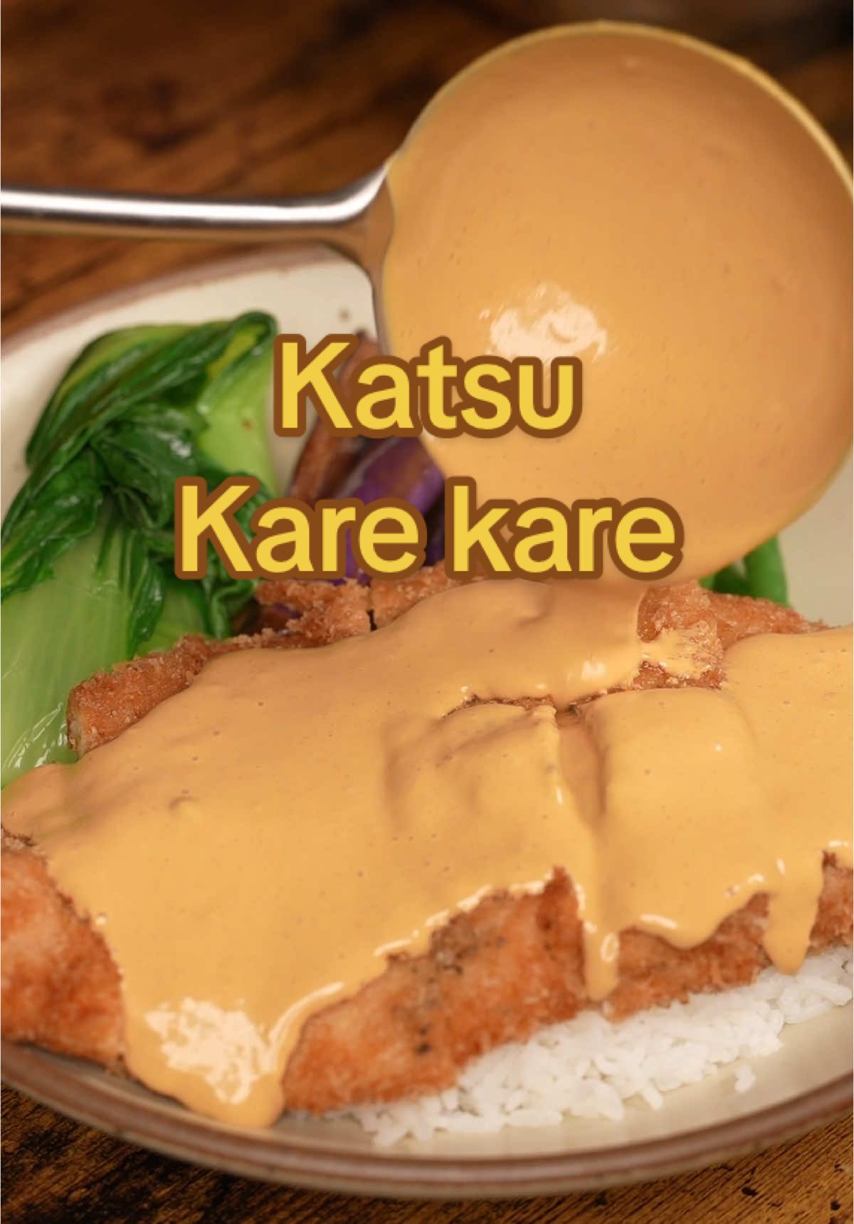 Chicken Katsu Kare Kare Ingredients Chicken Katsu: * Chicken breasts, pounded flat * Salt and black pepper, to taste * Flour, eggs, and panko (for coating) Kare Kare Sauce: * 3 cups water * 2 Tbsp annatto seeds * 2 Tbsp toasted rice flour* * 1 medium onion, diced * 5 garlic cloves, minced * 1 tsp fish sauce (to taste) * 1 tsp sugar (to taste) * 1 cup peanut butter (to taste) * 1.5 beef bouillon cubes (to taste) * Salt, to taste Vegetables: * Bok choy * Green beans * Chinese eggplant Optional Garnish: * Bagoong (Filipino shrimp paste) Instructions 1. Prepare Rice Flour: Blend uncooked rice into fine powder, then toast in a dry pan over medium heat until light brown, about 3–5 minutes. Set aside. 2. Make Kare Kare Sauce: Heat 2 Tbsp oil in a pot over medium heat. Sauté annatto seeds for 3–5 minutes to extract color, then discard seeds. Sauté onions with a pinch of salt for 5 minutes, add garlic, and cook 2 minutes. Add water, fish sauce, sugar, peanut butter, bouillon cubes, and rice flour. Simmer 20 minutes, stirring occasionally. Blend until smooth. Adjust thickness with rice flour as needed. 3. Prepare Vegetables: Blanch green beans and bok choy in boiling water for 1–2 minutes, then transfer to an ice bath. Sauté eggplant in oil for 3–5 minutes until softened and browned. Set aside. 4. Cook Chicken Katsu: Season chicken with salt and pepper. Coat in flour, dip in egg, and cover with panko. Fry at 350°F for 5–7 minutes until golden and cooked through (165°F internal temp). 5. Assemble and Serve: Serve chicken katsu with steamed rice, kare kare sauce, and vegetables. Garnish with bagoong if desired. Notes: Toasted rice flour thickens the sauce and adds a nutty flavor. Adjust seasonings to your taste. #katsu #karekare #japanese #Recipe #food #filipino #fusion #friedchicken #chicken #crispy #crunchy