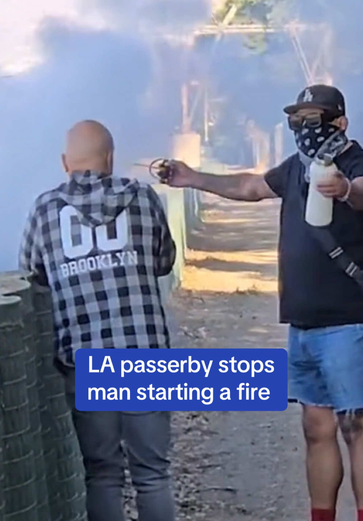 Another alleged Los Angeles firestarter was stopped by citizens after igniting brush in the Los Feliz neighborhood on Saturday. An exclusive video shows locals confronting the man in a plaid shirt who lit a pile of dead leaves and twigs in a built-up area next to the LA River in the east part of the city. It comes amid a string of deliberate fire-starting and suspected arson arrests during the past week. Read the full story at DailyMail.com. 🎥 Paul Haddad #news #losangeles #california #fires