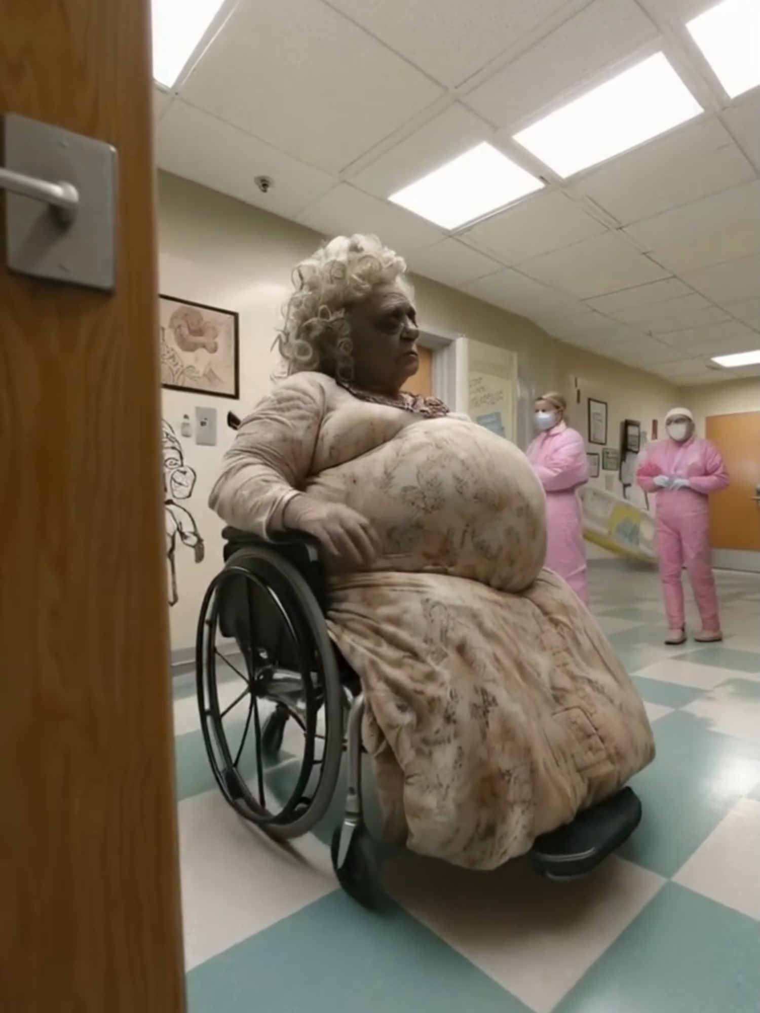 The Mystery Patient: Who—or What—is She? 🛑👵👽 Caught on camera in a top-secret facility: a mysterious elderly woman, or perhaps something more. Sitting in a wheelchair with an unearthly appearance, her presence commands attention. The medical staff in protective suits seem cautious, as if they know something we don’t. Is she an alien? The result of an experiment? Or something else entirely? Her expression holds secrets we may never uncover. What do you think is the story behind this enigmatic figure? Let us know below! 👇 #Pregnant #horrortok @hailuoai_official