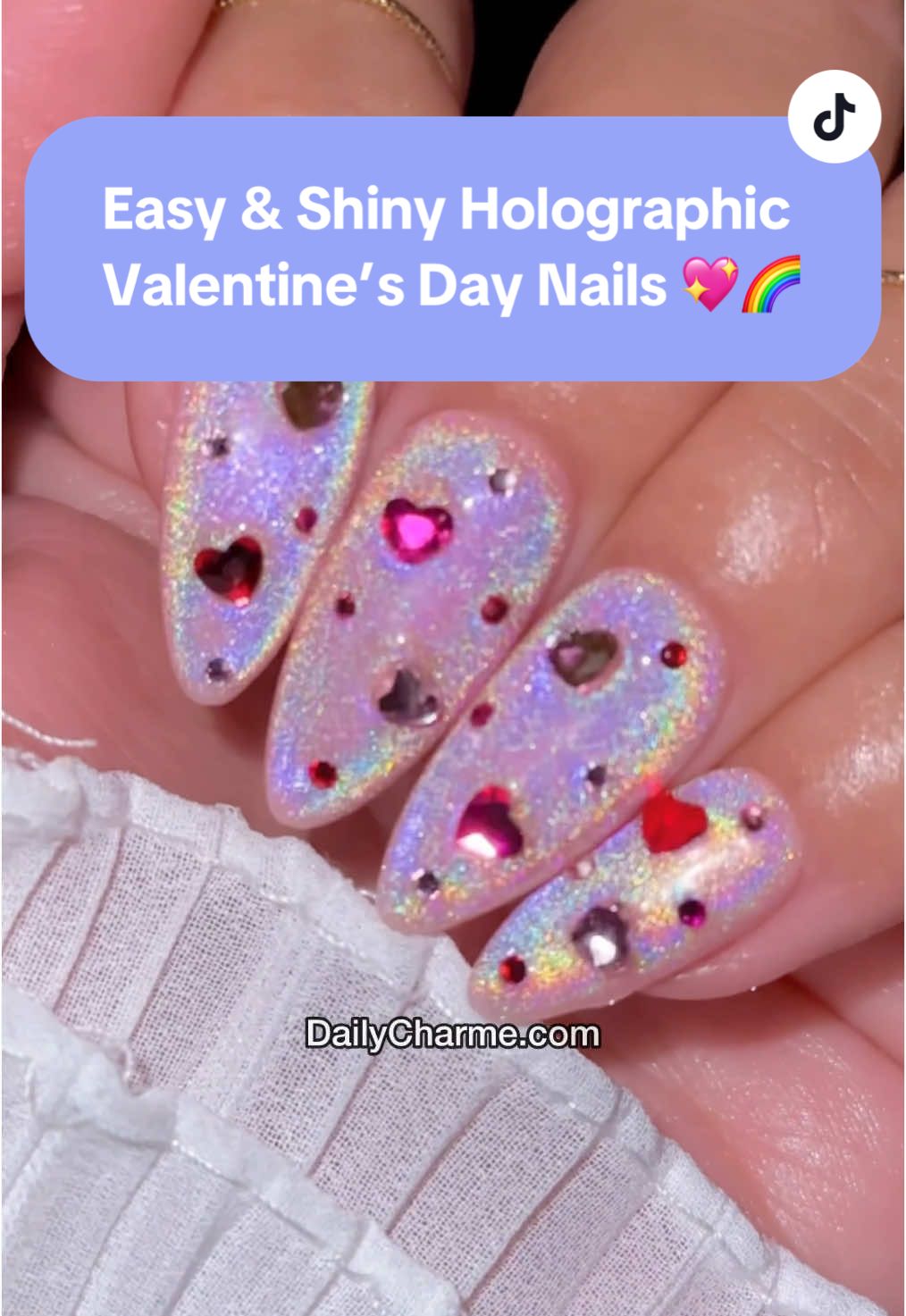 POV: You just found the shiniest holographic nails for Valentine’s Day 💖✨🌈  💅 Everything used for this look is from the brand Daily Charme & is listed below. All goodies are available now in our TikTok shop or via the 🔗 in bi0 💖 💅 Save & share to inspire your next Valentine’s mani! ✨ Using @daily_charme: 💖 Almond Medium Clear Charme Gel Extension Tips 💖 J01 Chiffon 💖 C07 Unikitty 💖 Charme Crystal Lovely Hearts Mix 💖 Charme Crystals 