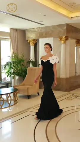 Model Ghalia Couture shines in a black dress decorated with roses on the sleeves, where elegance✨ #ghaliacouture #fyp #fyyp