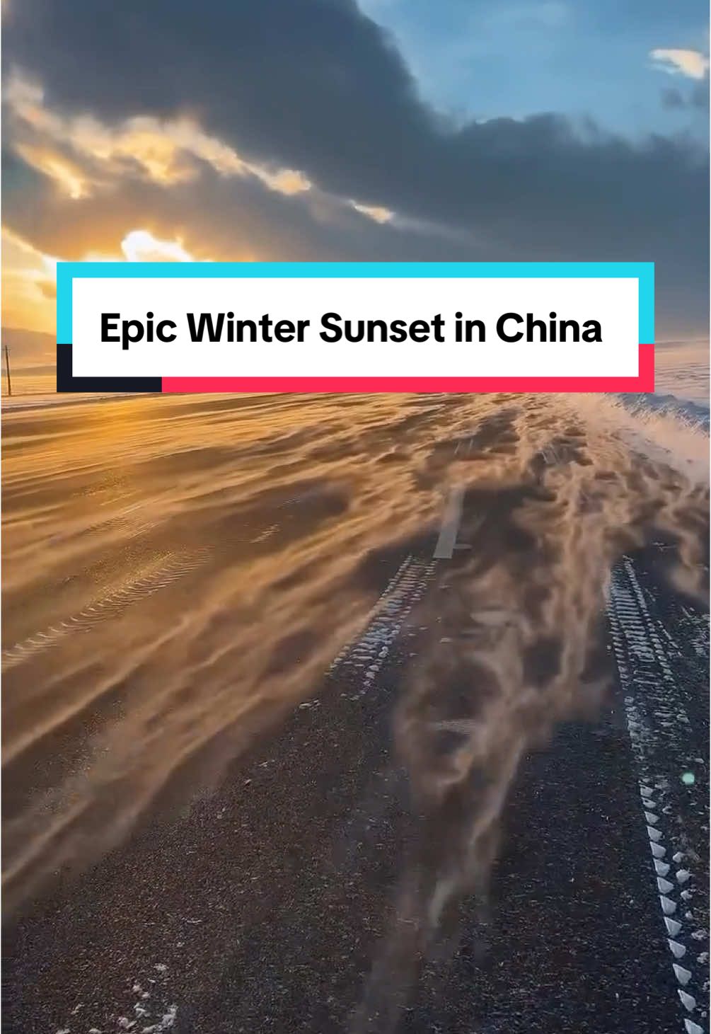 Where winter meets sunlight ✨ Gusts of snow create mesmerizing patterns across a remote road as storm clouds part for a brilliant sunset.  Share this with someone who needs to see this 🤩 🎥 @uniquehell_  📍Xinjiang, China  #chinatravel #chinatiktok #sunlight #wintertime #winter