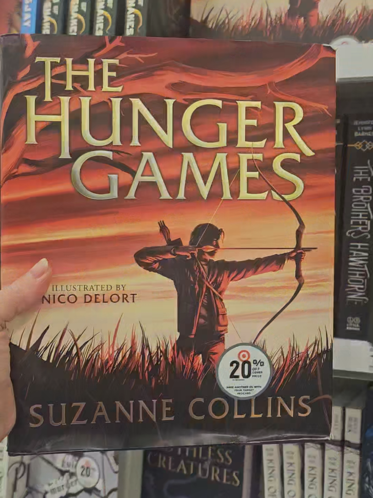 The Hunger Games Illustrated Edition #thehungergames #thehungergamesillustratededition #reader #BookTok #bookish #books #targetbooks #bookshopping #booklover #beautifulbooks #bibliophile #booksandcoffee #booksattarget #targetbookshopping #gorgeousbooks #katniss #peetamellark #katnissandpeeta #katnisseverdeen #balladofsongbirdsandsnakes #everlark #mockingjay #peetaandkatniss #booksillneverforget #booksthatwillbreakyourheart #booksthatgotmeintoreading #mustreadbooks #bookrecs