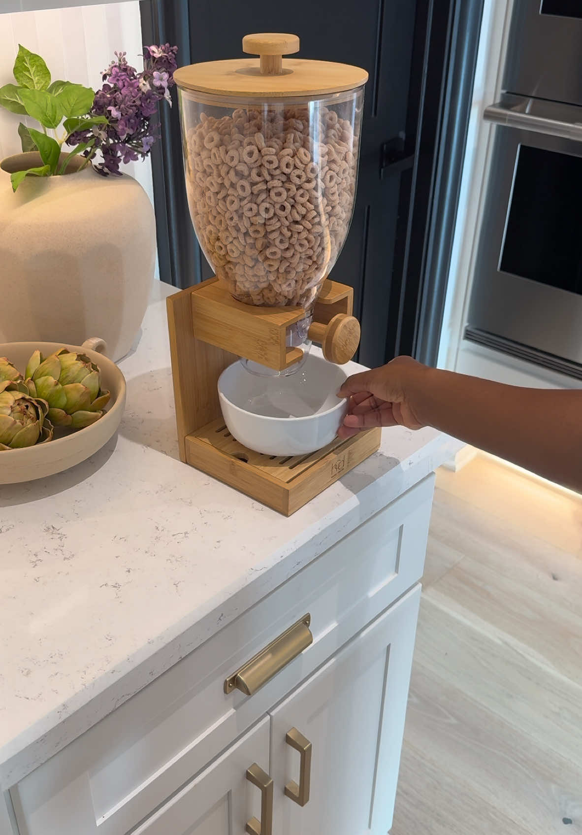 These bamboo cereal and food dispensers are a must-have! Easy to assemble and clean, they keep food fresh and make breakfast a breeze for kids to serve themselves. A pantry must have! #cereal #pantryorganization #pantry #pantryrestock #pantrygoals 